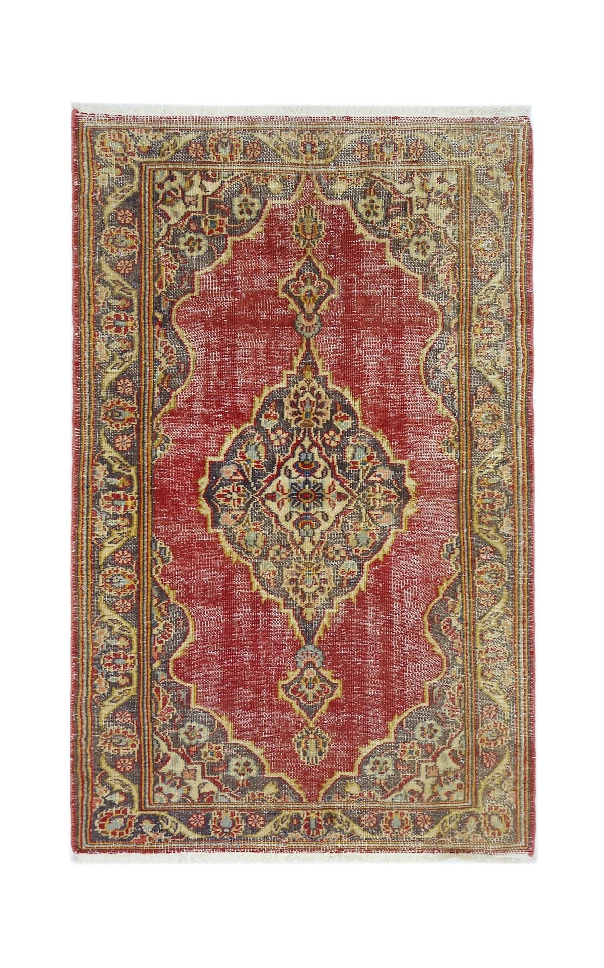 A vintage handmade Persian rug featuring a central medallion on a red field with ornate borders.