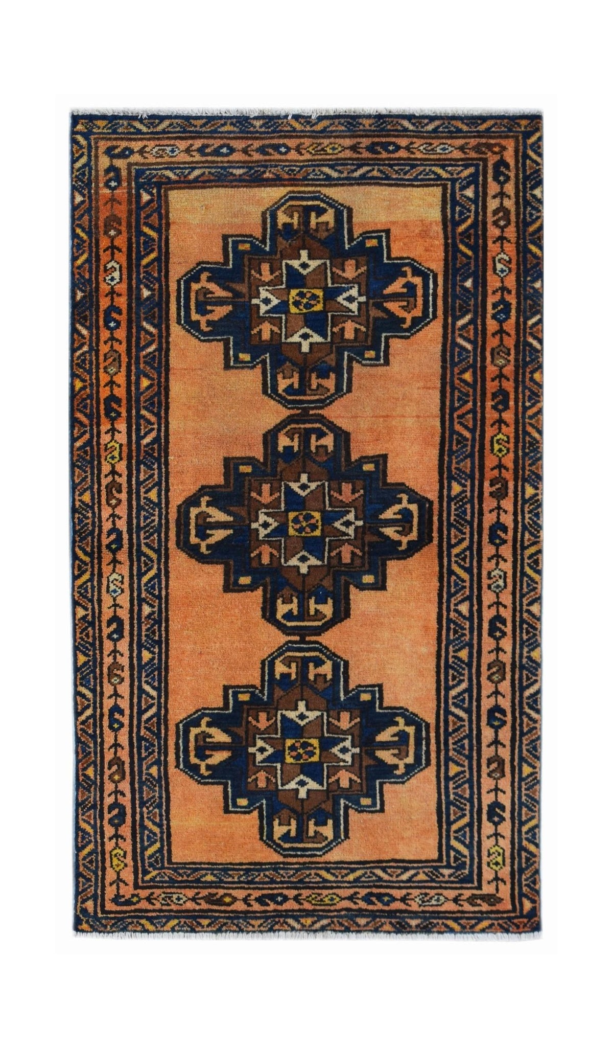 A vintage Persian rug featuring three dark blue geometric medallions on an orange field.