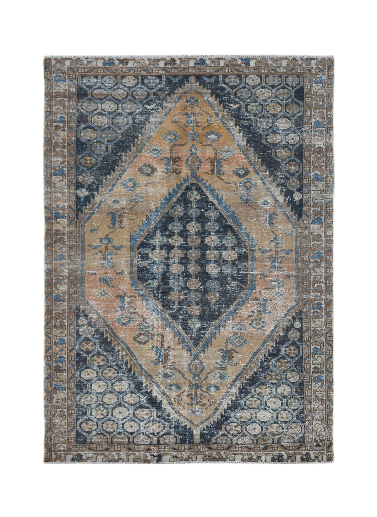 A vintage Persian rug featuring a central diamond medallion in shades of blue, tan, and brown.