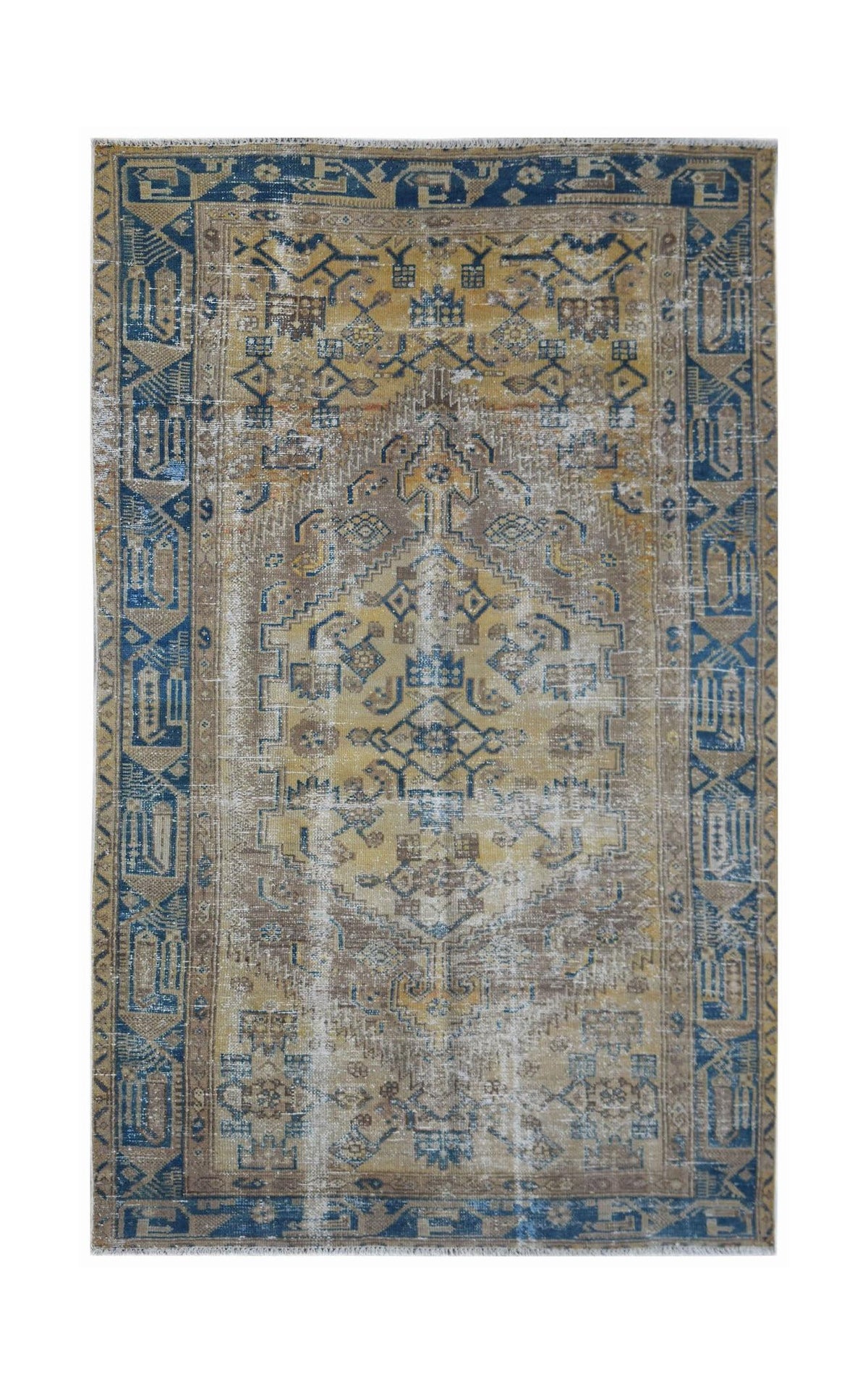 A vintage handwoven Persian rug featuring a distressed geometric pattern in blue and gold tones.
