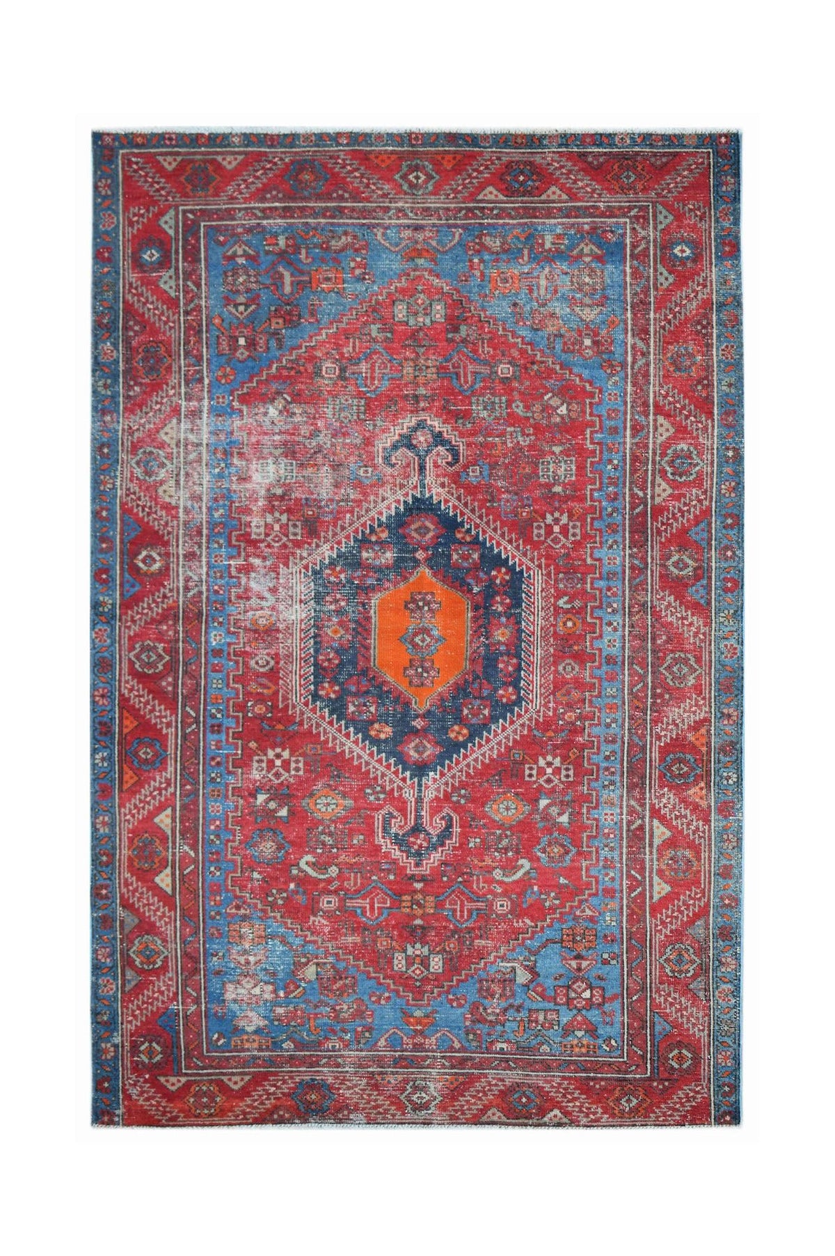 Vintage Persian rug featuring a central orange medallion on a red and blue geometric field.