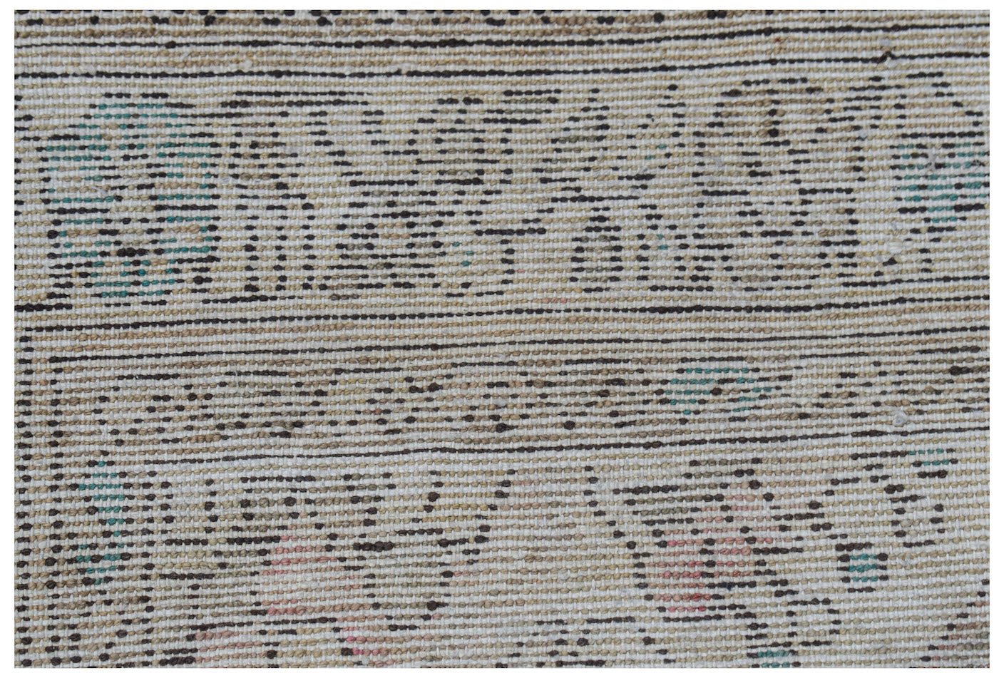 Vintage Persian rug with a woven pattern in neutral tones and subtle blue and pink accents.