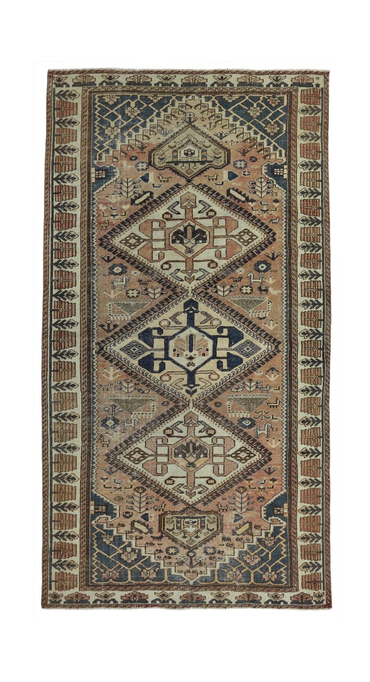 A handmade vintage Persian rug featuring a geometric diamond pattern in muted earth tones.