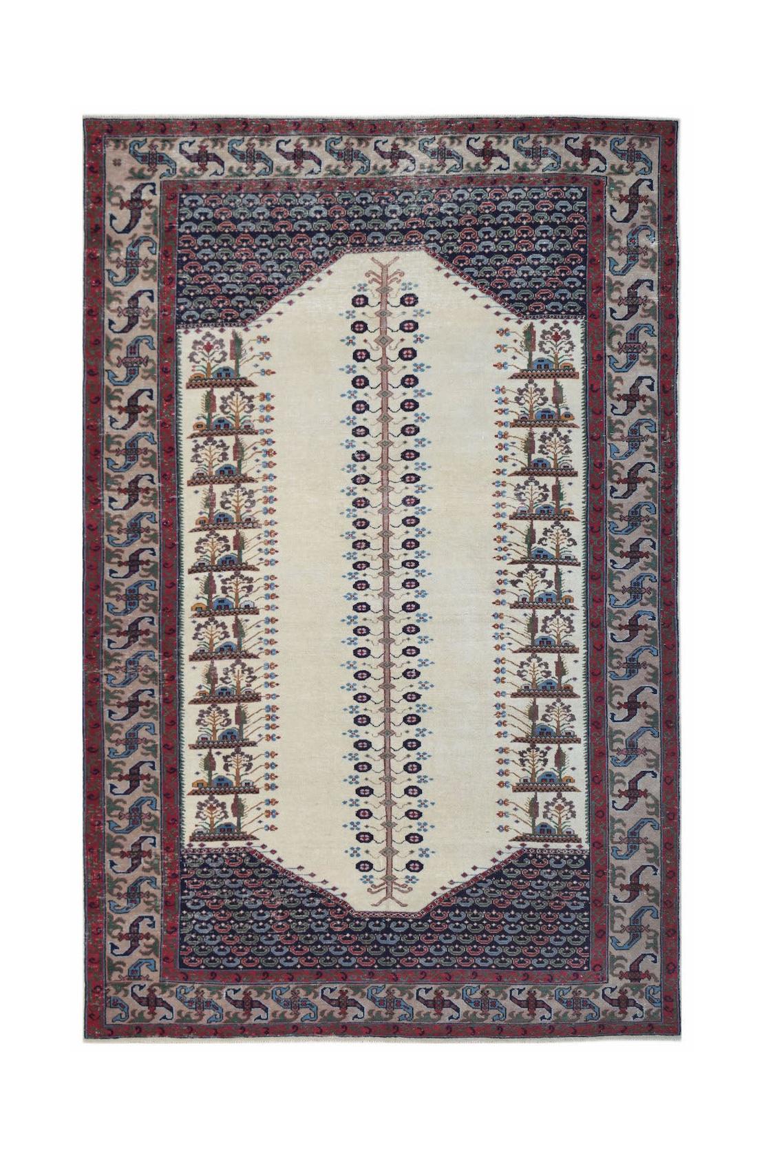 A vintage handwoven Persian rug featuring a central tree motif on a cream field with blue borders.