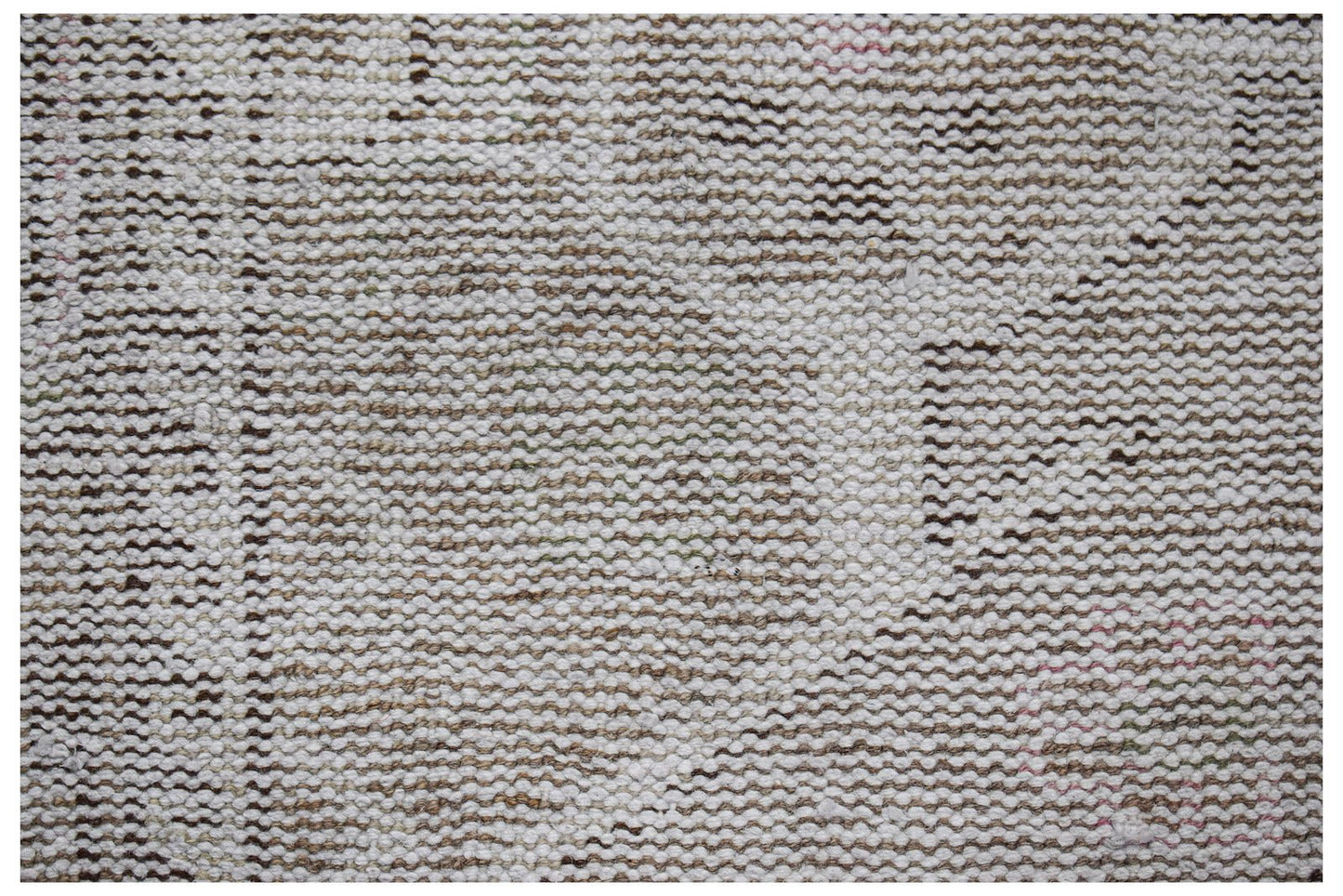 A close-up view of a vintage Persian runner featuring a faded, handwoven wool pattern.