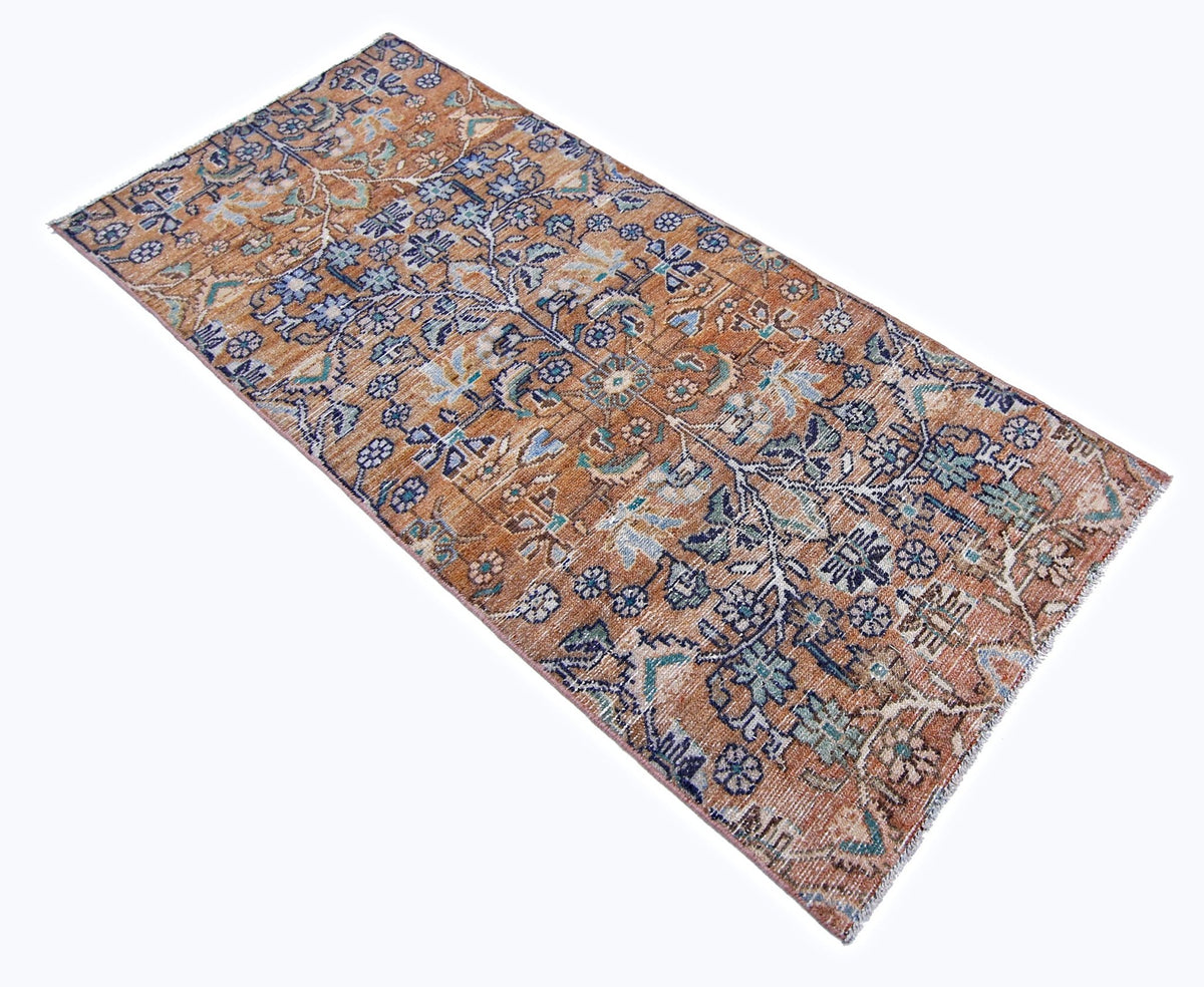 Vintage Persian Sarouk runner in rust orange with blue and cream floral patterns and hand-knotted wool pile.