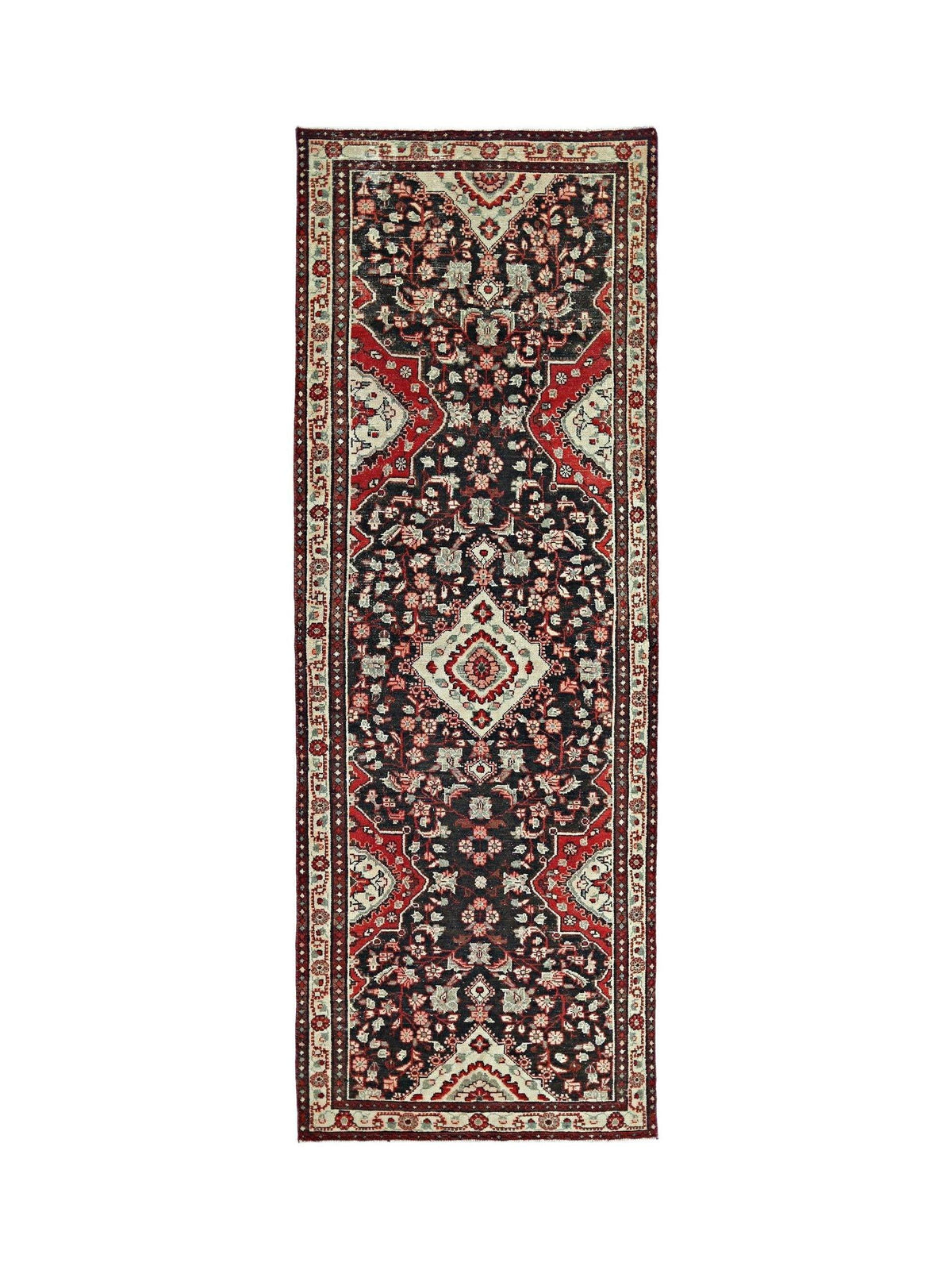 Vintage Persian Sarouk runner in black, red, and cream featuring a dense, hand-knotted floral pattern on wool.