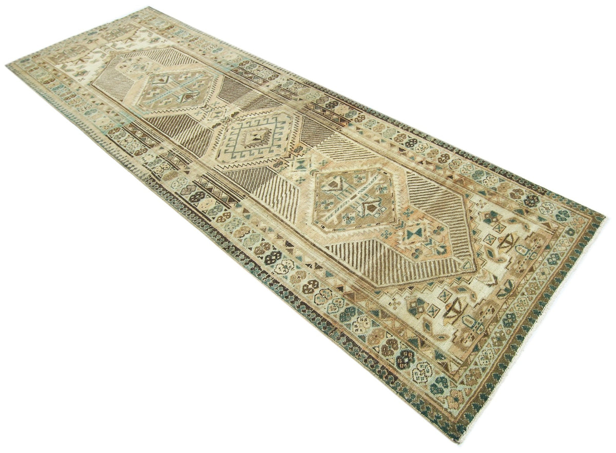 Vintage Persian Serab runner in neutral wool with geometric diamond motifs and a detailed border on a cream background.