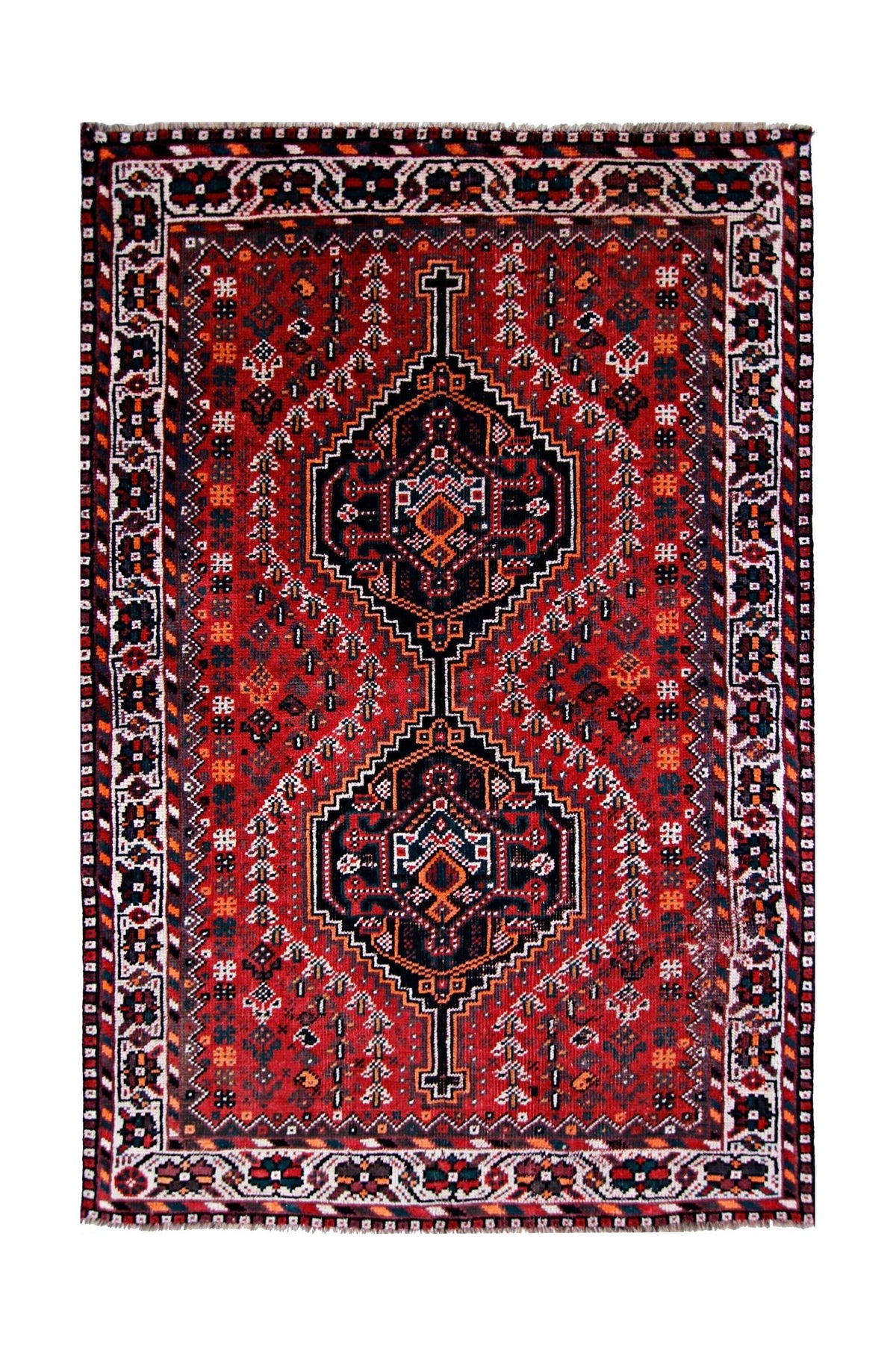 Hand-knotted vintage Shiraz rug featuring bold red, black, and geometric diamond medallions with a wool fringe.
