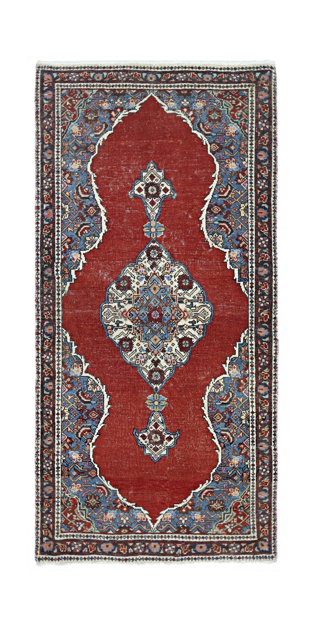 Hand-knotted vintage Persian Tabriz wool rug featuring a red field, central blue medallion, and intricate floral borders.