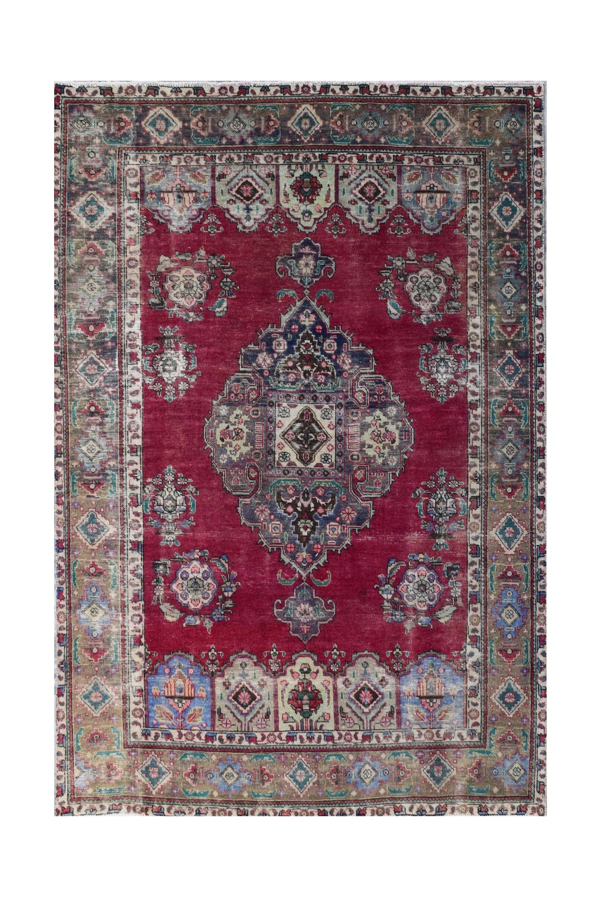 A vintage Persian Tabriz rug featuring a central medallion on a deep red field with floral motifs.