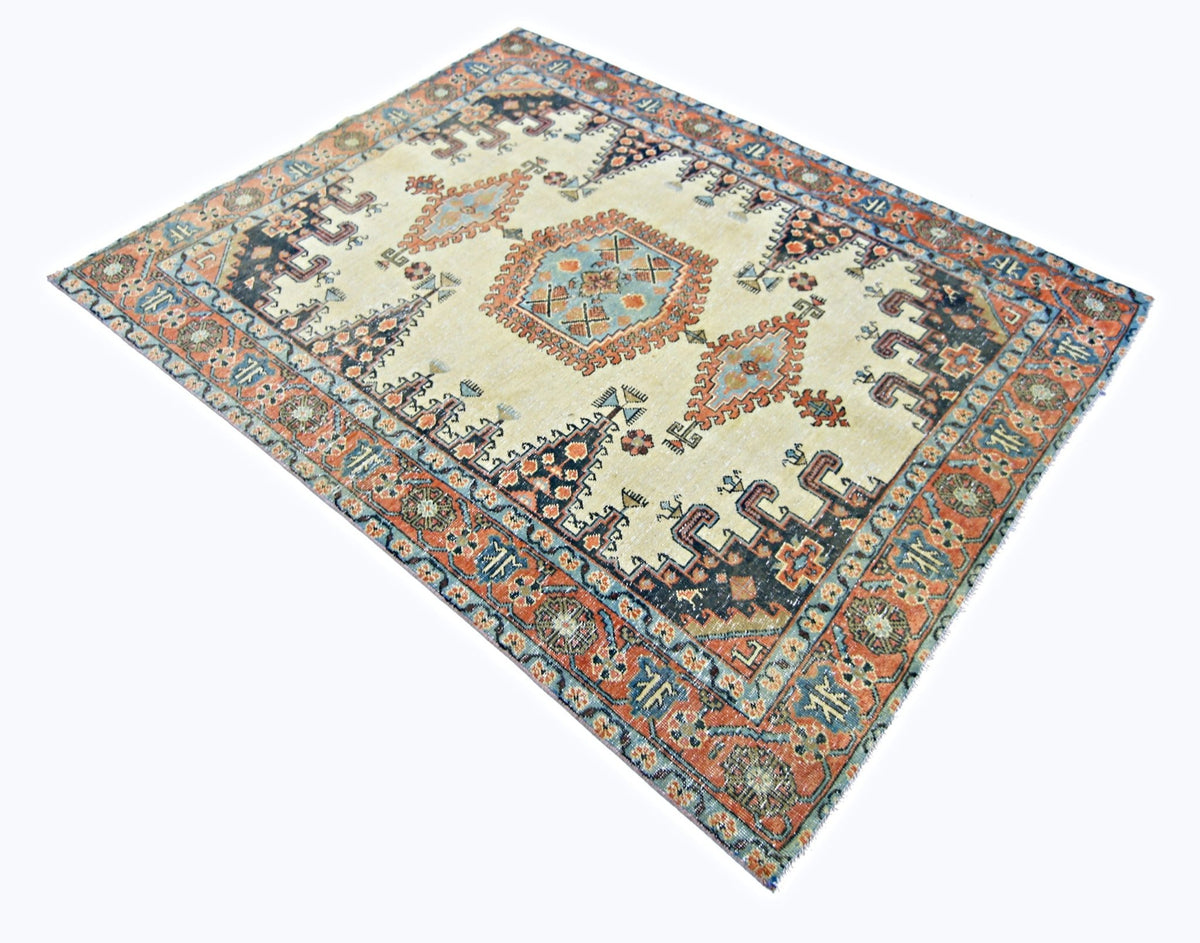 Vintage hand-knotted wool Persian Wiss rug featuring a cream field with geometric medallions and a detailed border.