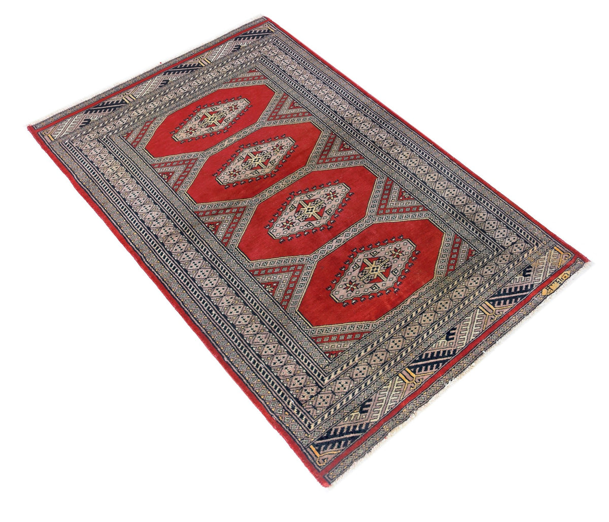 Hand-knotted Pakistani Princess Bokhara rug in red with repeating geometric gul patterns and a detailed cream border.