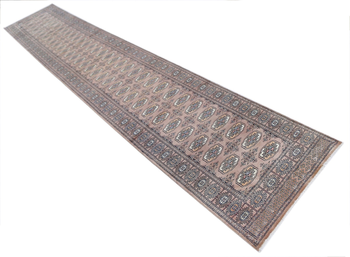 Vintage Princess Bokhara runner with rows of refined guls in soft muted tones and geometric borders on a white background.