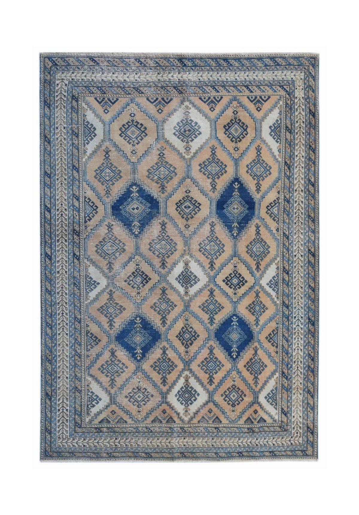 Vintage Anatolian rug featuring a blue and beige diamond lattice pattern with intricate geometric motifs.