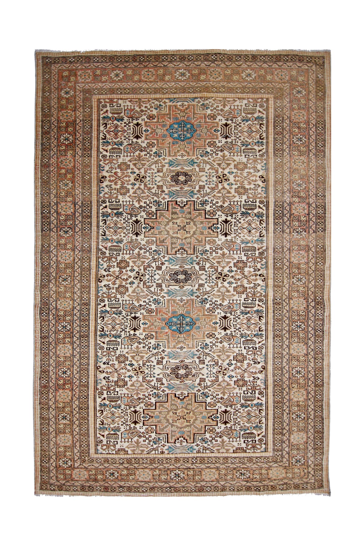 Vintage Anatolian rug featuring a geometric medallion design in muted earth tones, blue accents, and a detailed border.