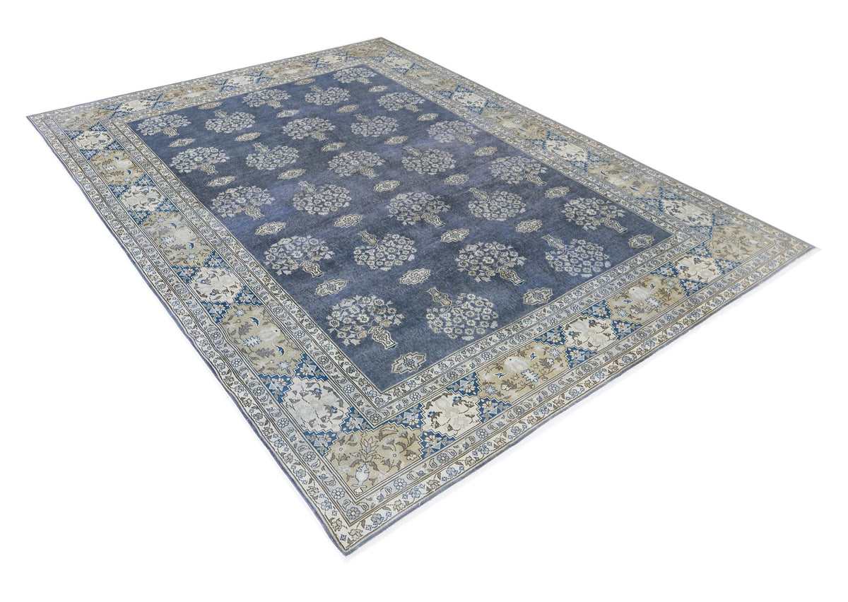 Vintage Turkish Anatolian rug with a blue field, repeating floral motifs, and a detailed beige and blue border.