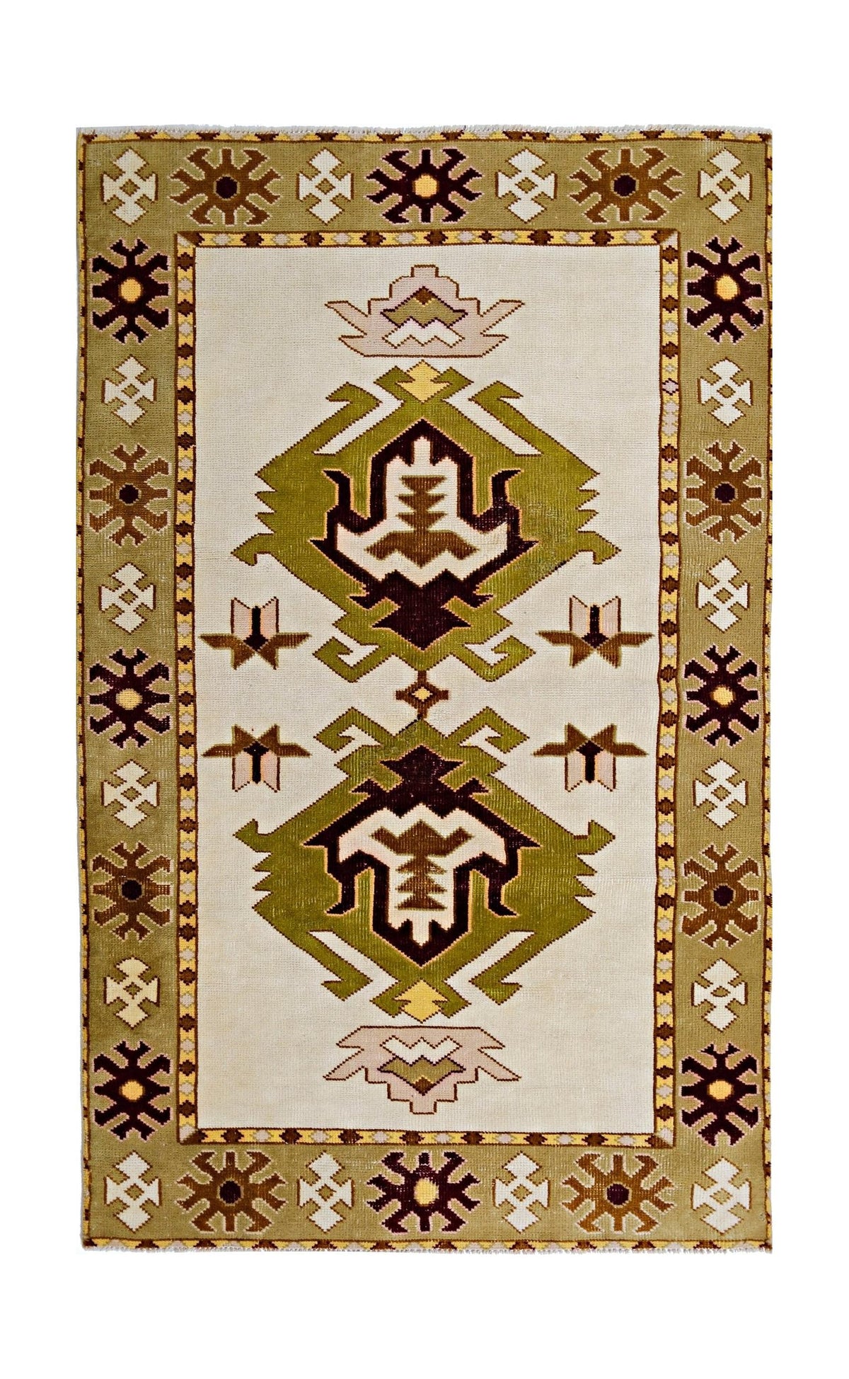 Vintage Turkish Milas rug featuring geometric botanical motifs in olive, brown, and cream with a stepped border and fringe.