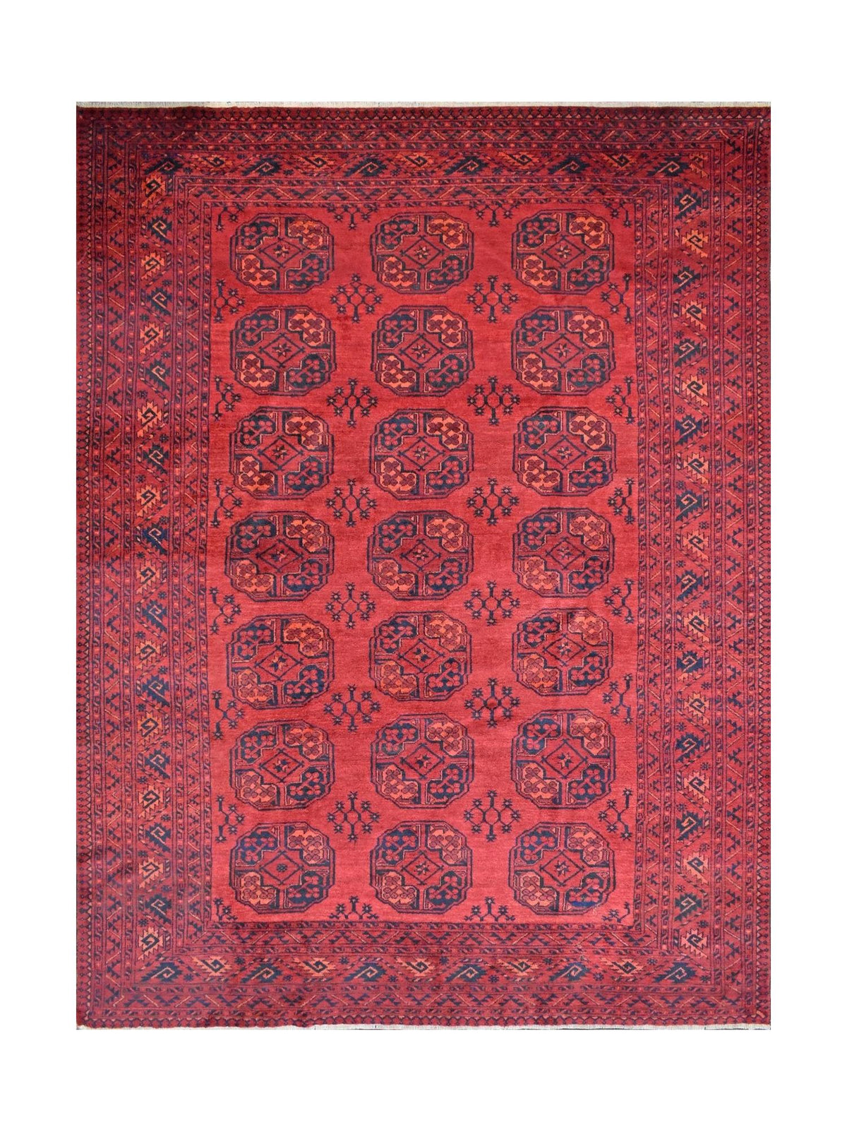 Hand-knotted red Bokhara rug with repeating blue gul medallions, geometric borders, and wool fringe.