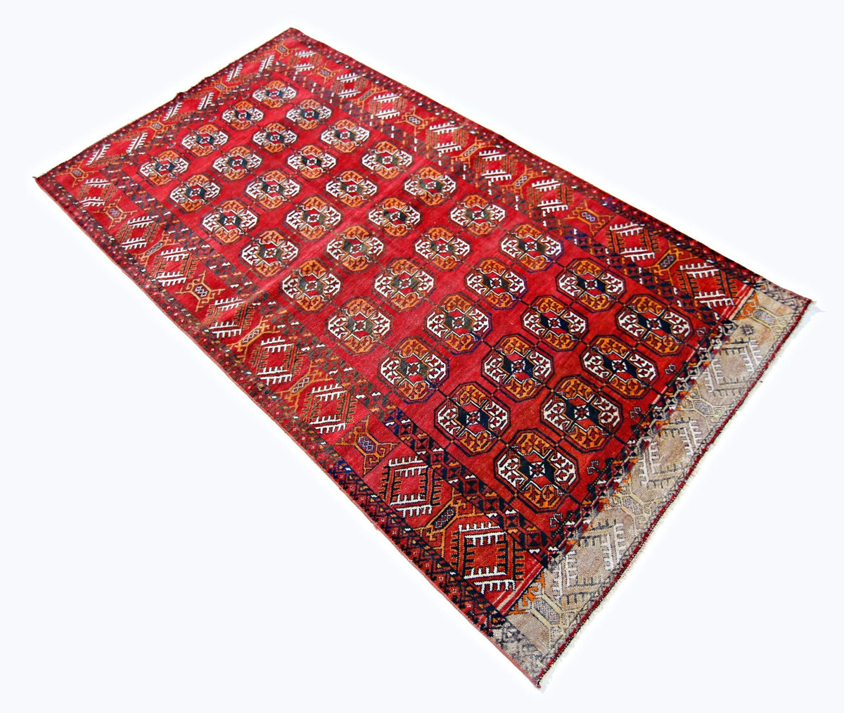 Hand-knotted vintage Turkmen Ersari rug in deep red with repeating elephant's foot guls and a wool fringe.