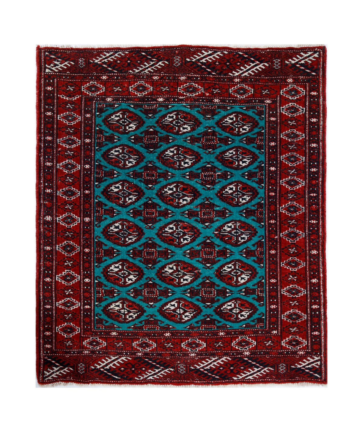 Vintage Turkmen Tekke rug featuring a teal field with repeating octagonal guls in deep red, ivory, and indigo blue.