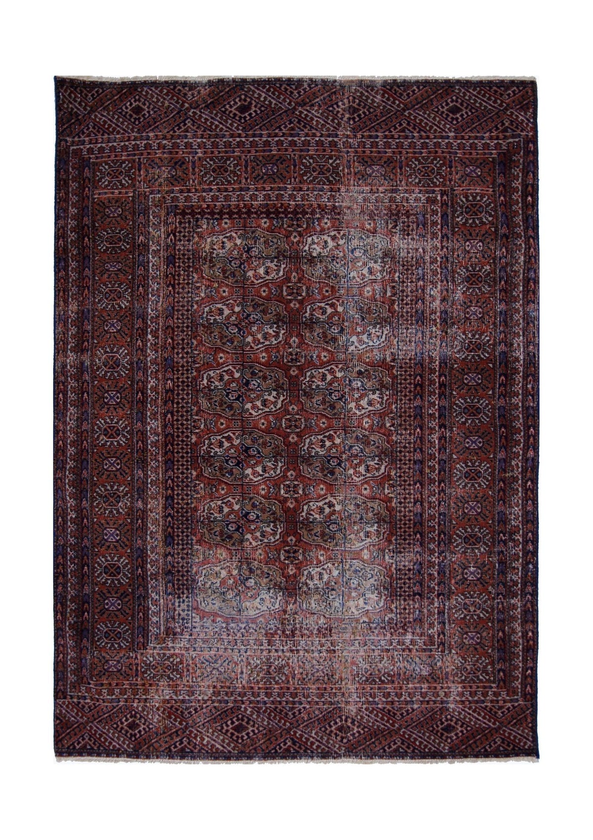 Vintage Turkmen Tekke rug with a deep crimson field, repeating octagonal gul medallions, and indigo and ivory accents.