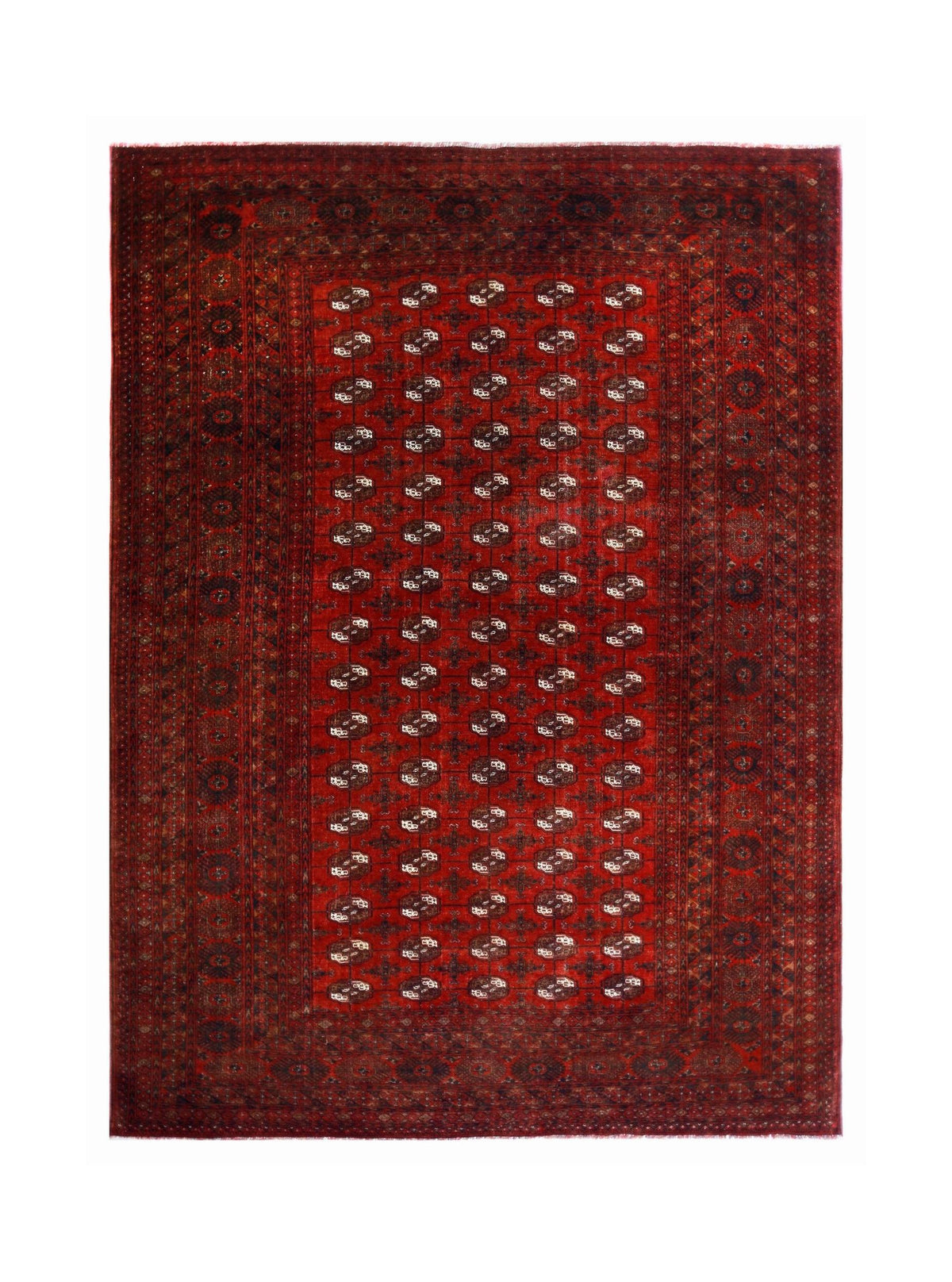 Vintage Turkmen Tekke rug featuring rows of octagonal gul medallions on a deep crimson field with indigo and ivory accents.