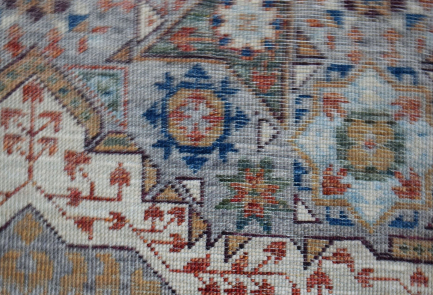 A close-up of a handwoven Afghan Chobi runner featuring a detailed Mamluk medallion pattern.