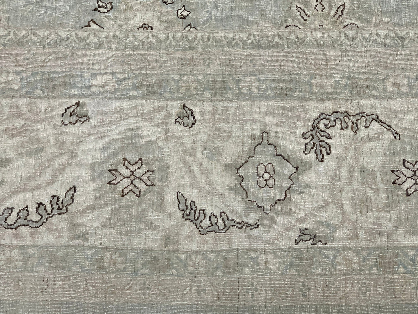 A handmade Afghan Balkh rug featuring a neutral palette with traditional floral and geometric motifs.