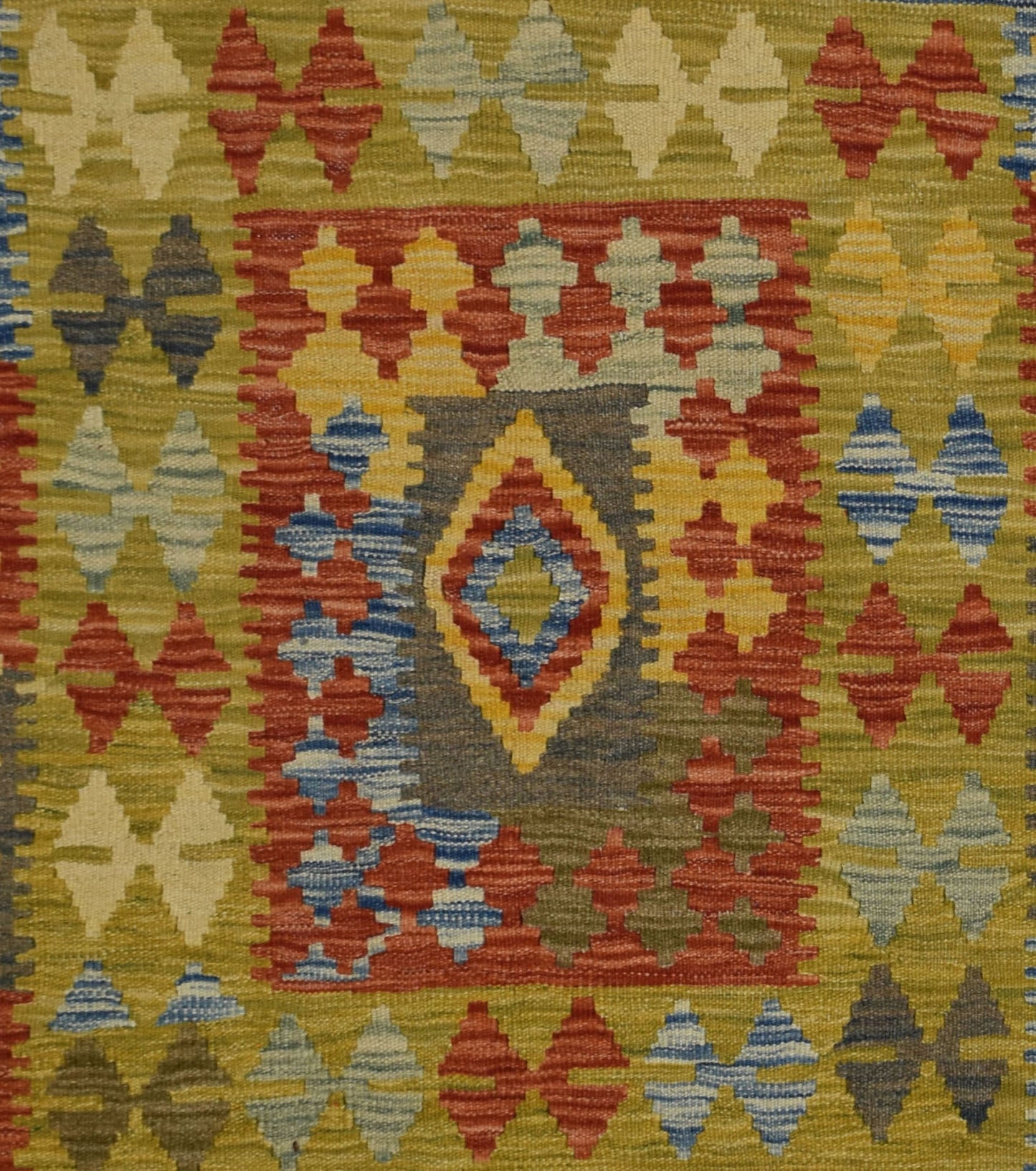 Handmade Afghan Maimana kilim rug featuring a geometric diamond pattern in vibrant wool colors.