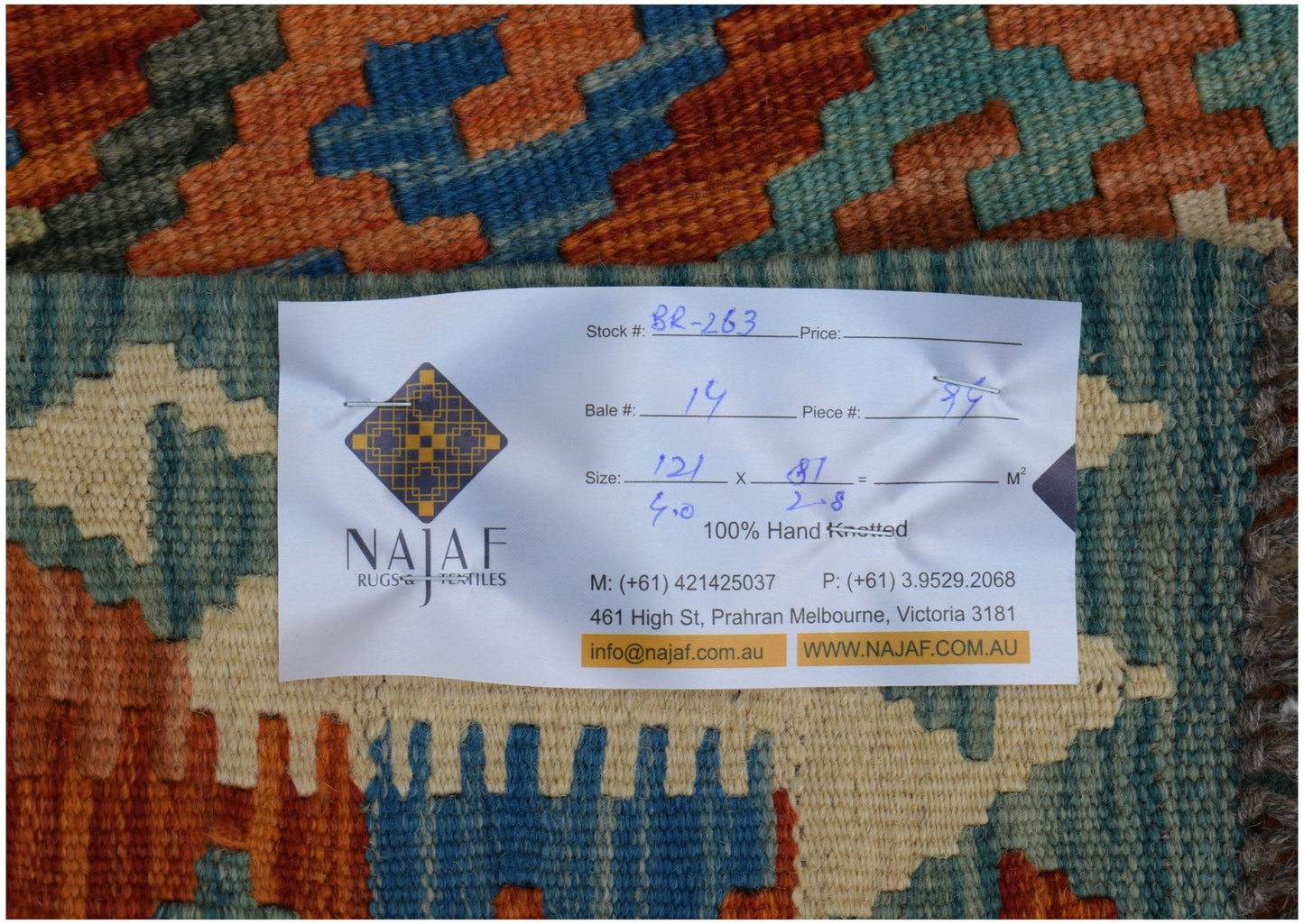 A handwoven Afghan Maimana kilim featuring a geometric pattern in shades of orange, blue, and cream.