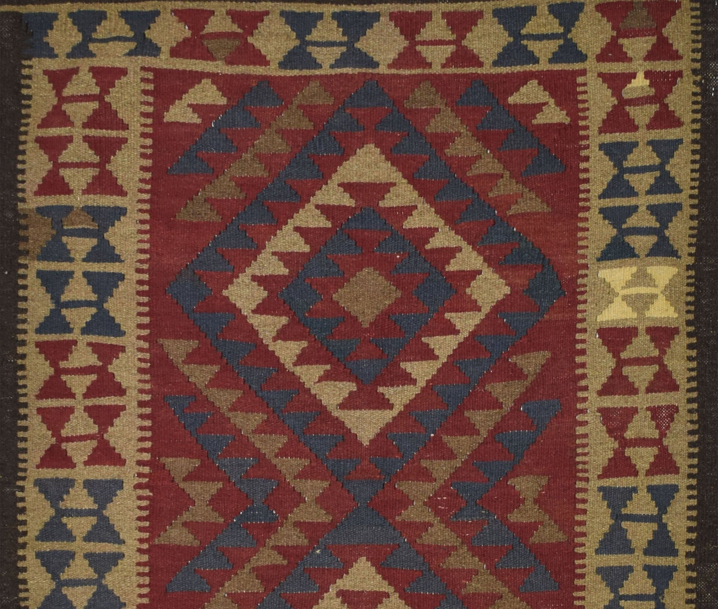 Handmade Afghan Maimana kilim rug featuring a geometric diamond pattern in red, blue, and tan.
