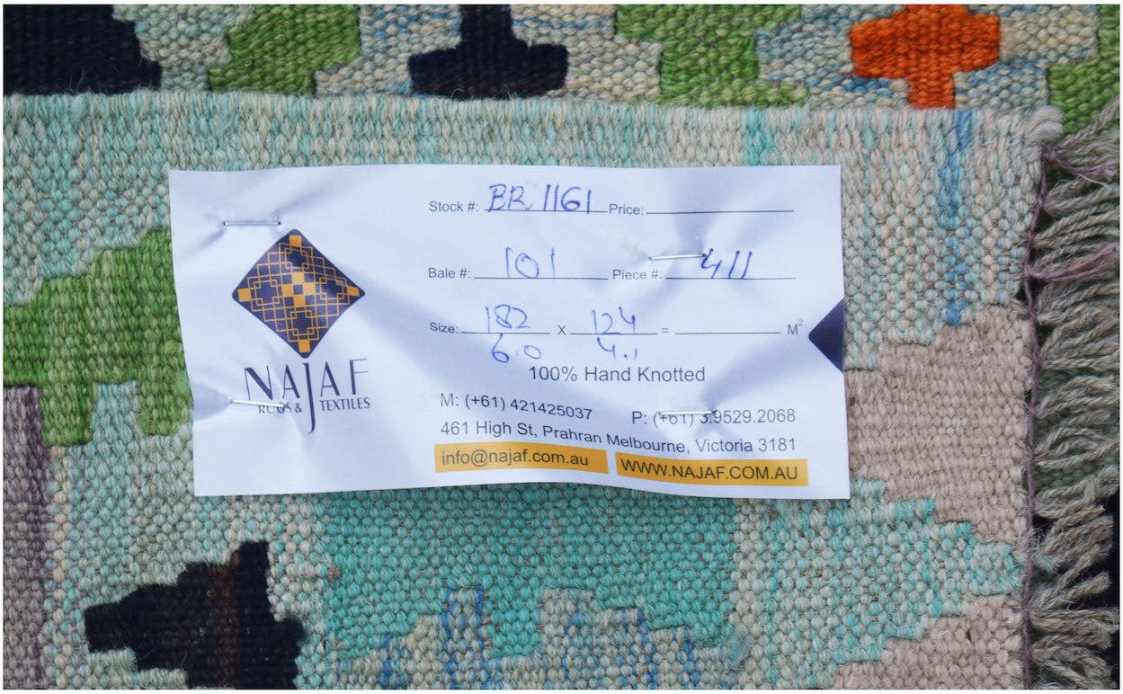A handwoven Afghan Maimana Kilim featuring a colorful geometric pattern on a flat wool weave.