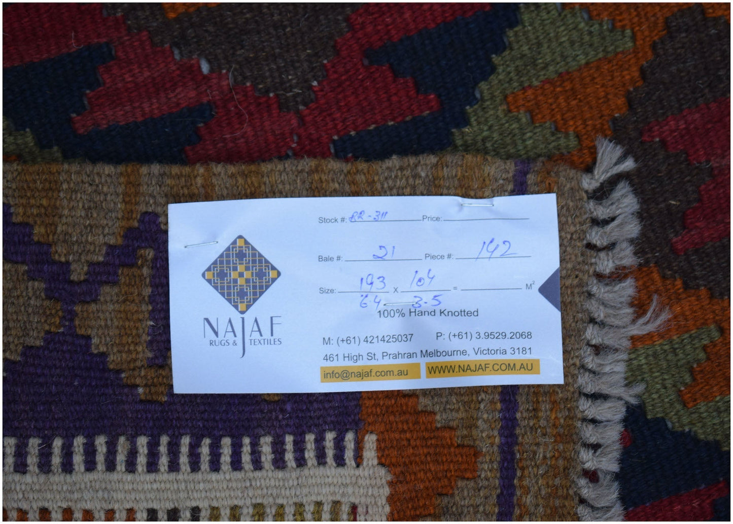 A flat-woven Afghan Maimana Kilim rug featuring a geometric pattern in rich, multi-colored tones.