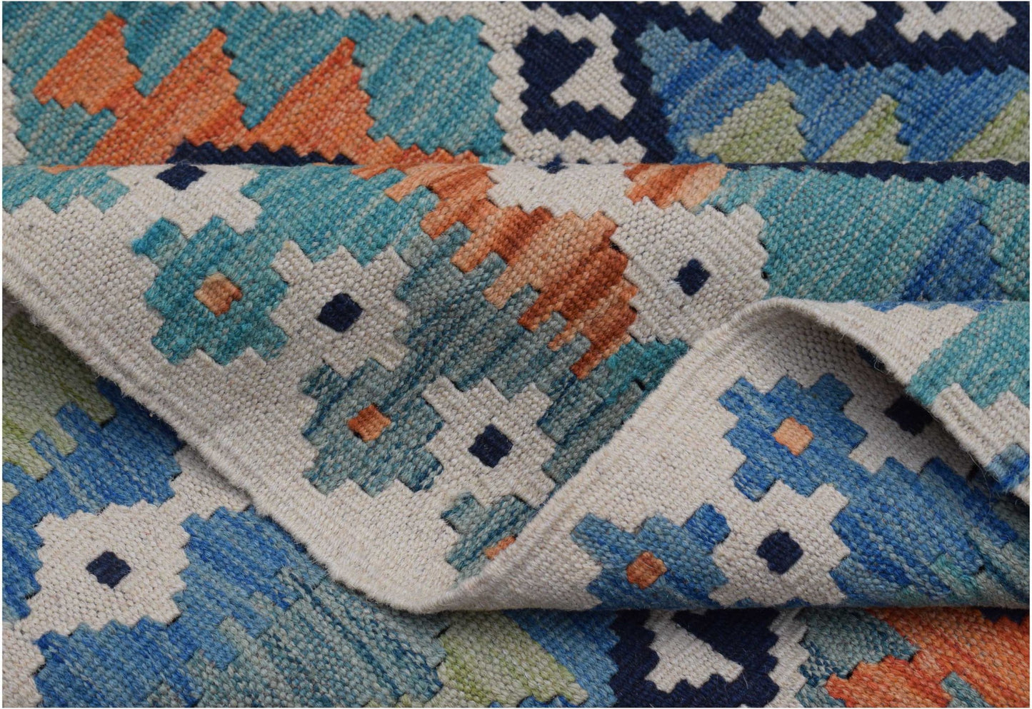 A handmade Afghan Maimana kilim rug featuring a geometric pattern in blue, orange, and cream wool.