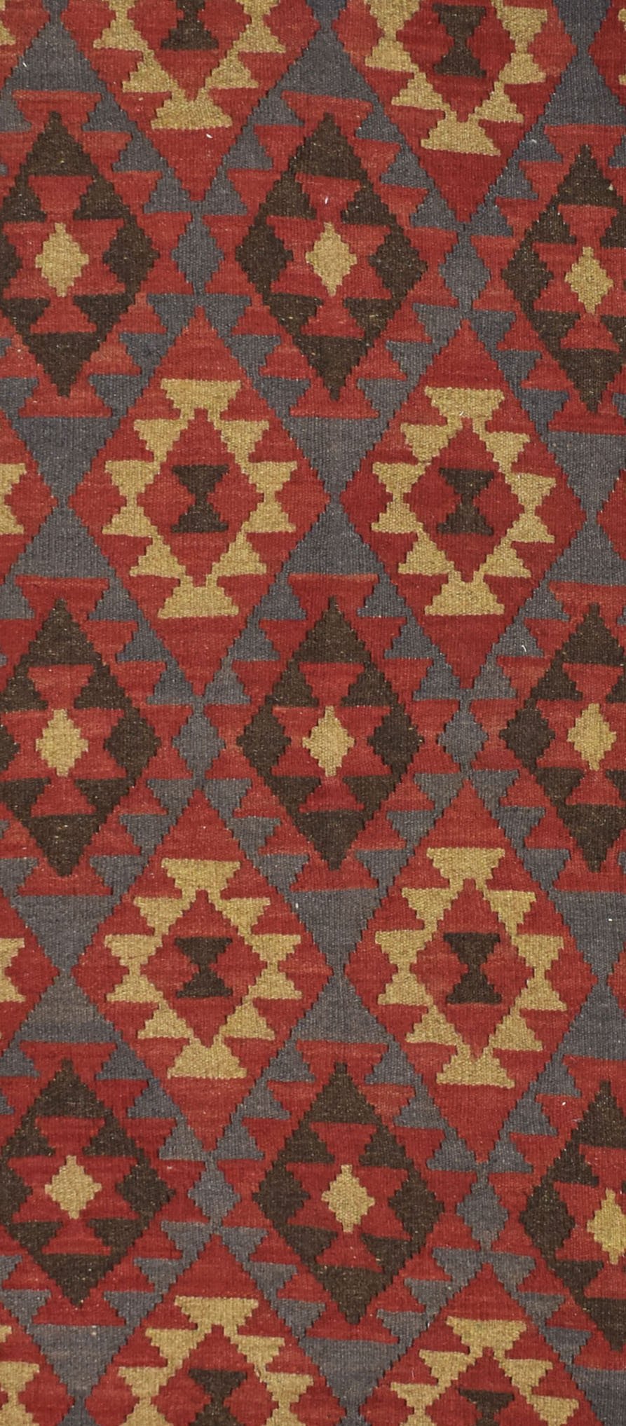 Handmade Afghan Maimana kilim rug featuring a repeating geometric diamond pattern in red and tan.