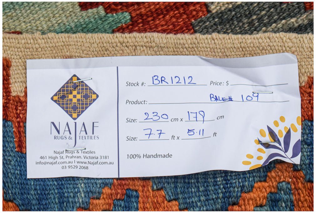 Afghan Maimana Kilim with geometric patterns and a handwritten tag.