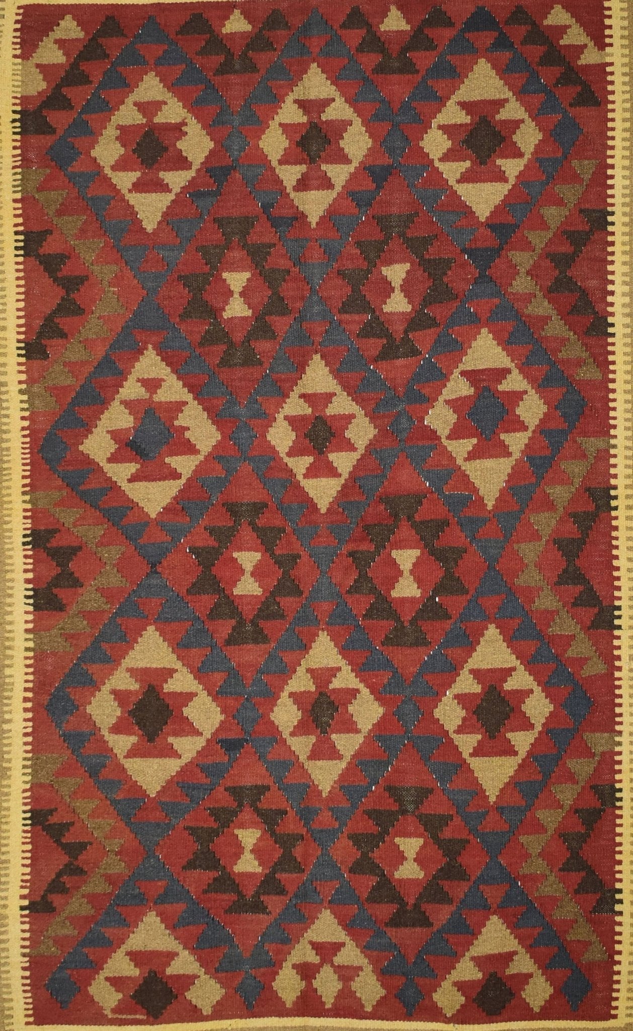 Handmade Afghan Maimana kilim rug featuring a repeating geometric diamond pattern in earthy tones.