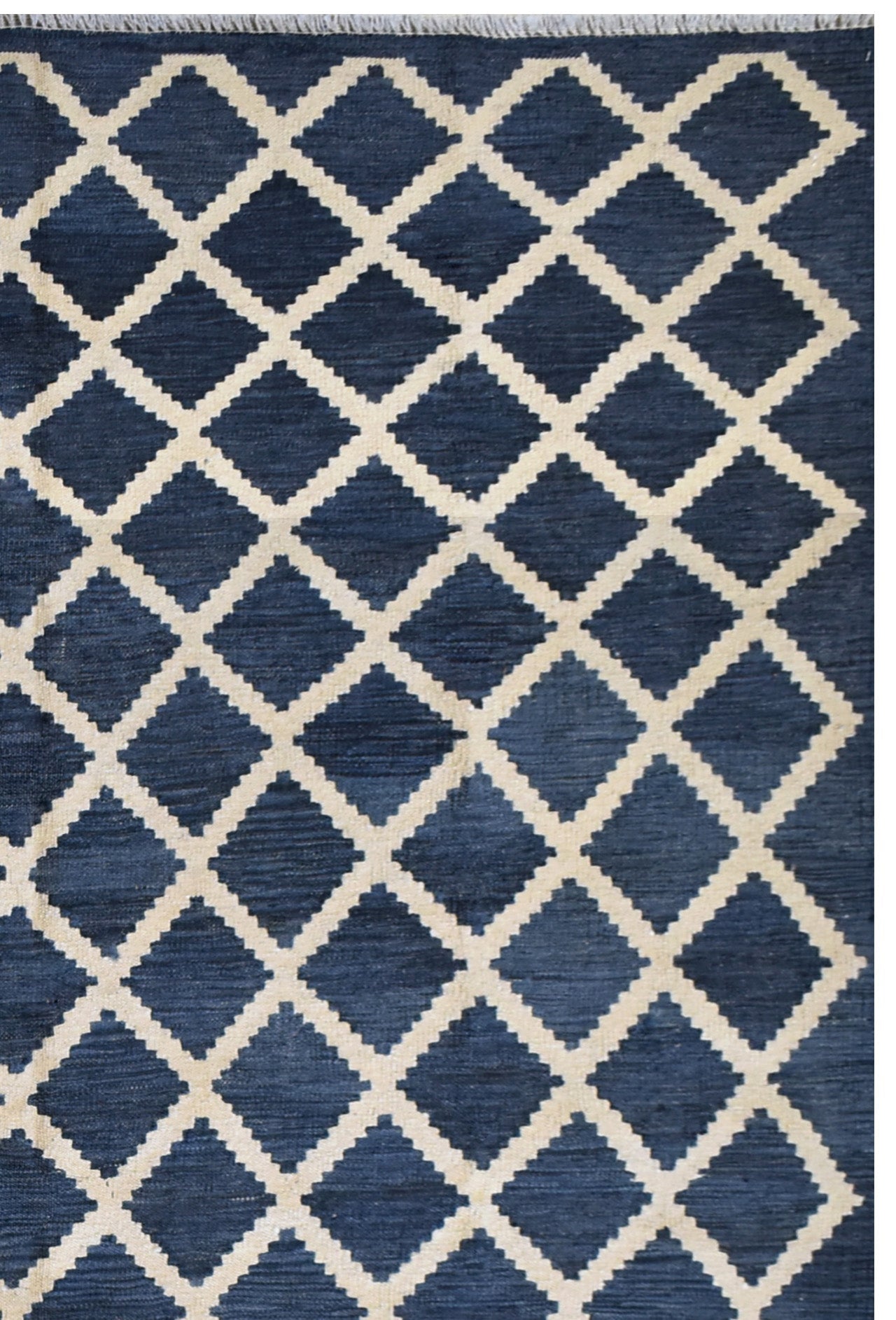Handmade Afghan Maimana kilim rug featuring a dark blue and cream geometric diamond pattern.