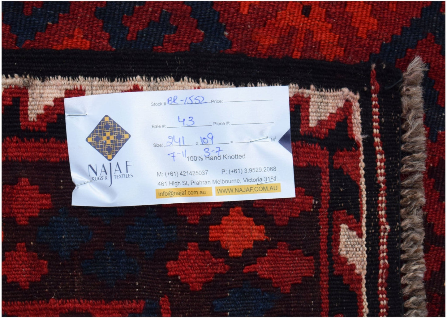 A handmade Afghan Maimana kilim featuring a geometric pattern in red and dark blue wool.