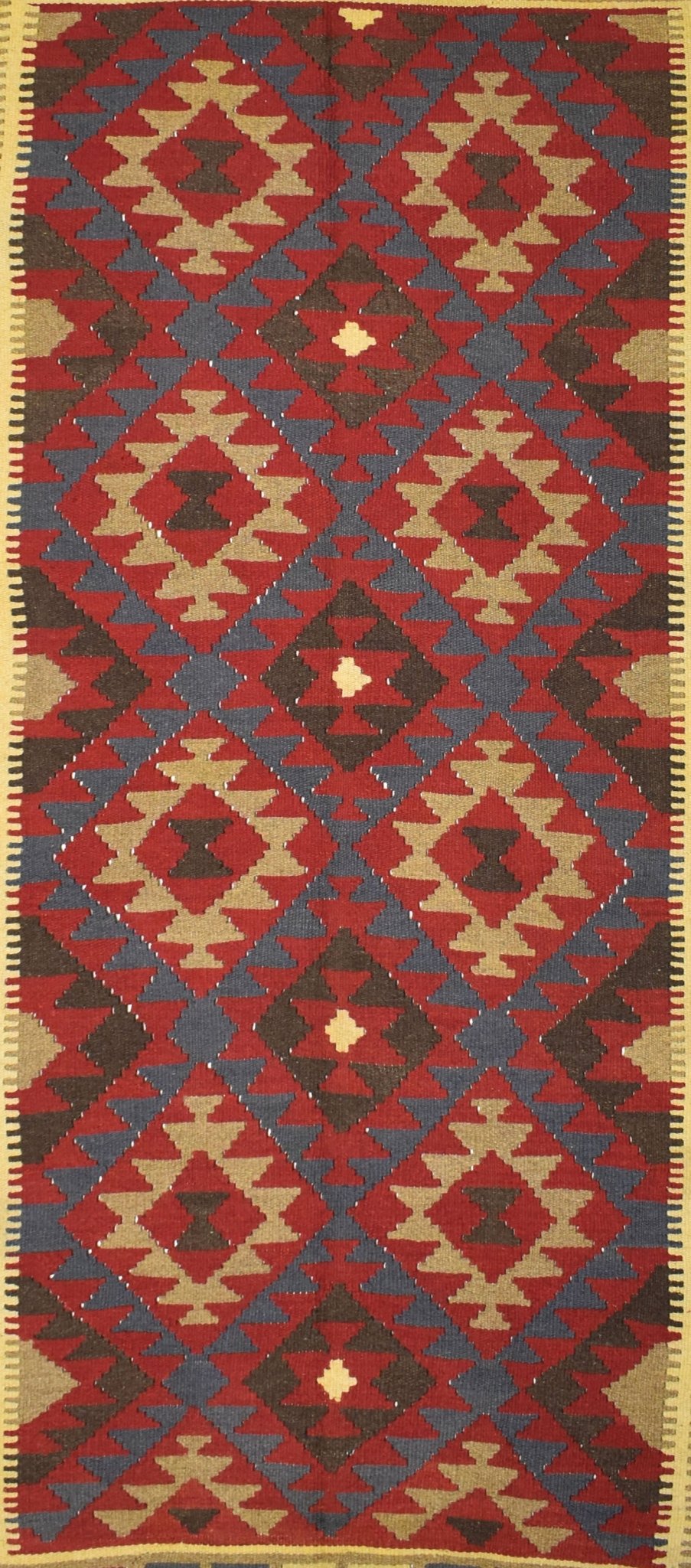 Handmade Afghan Maimana kilim rug featuring a repeating geometric diamond pattern in earthy tones.