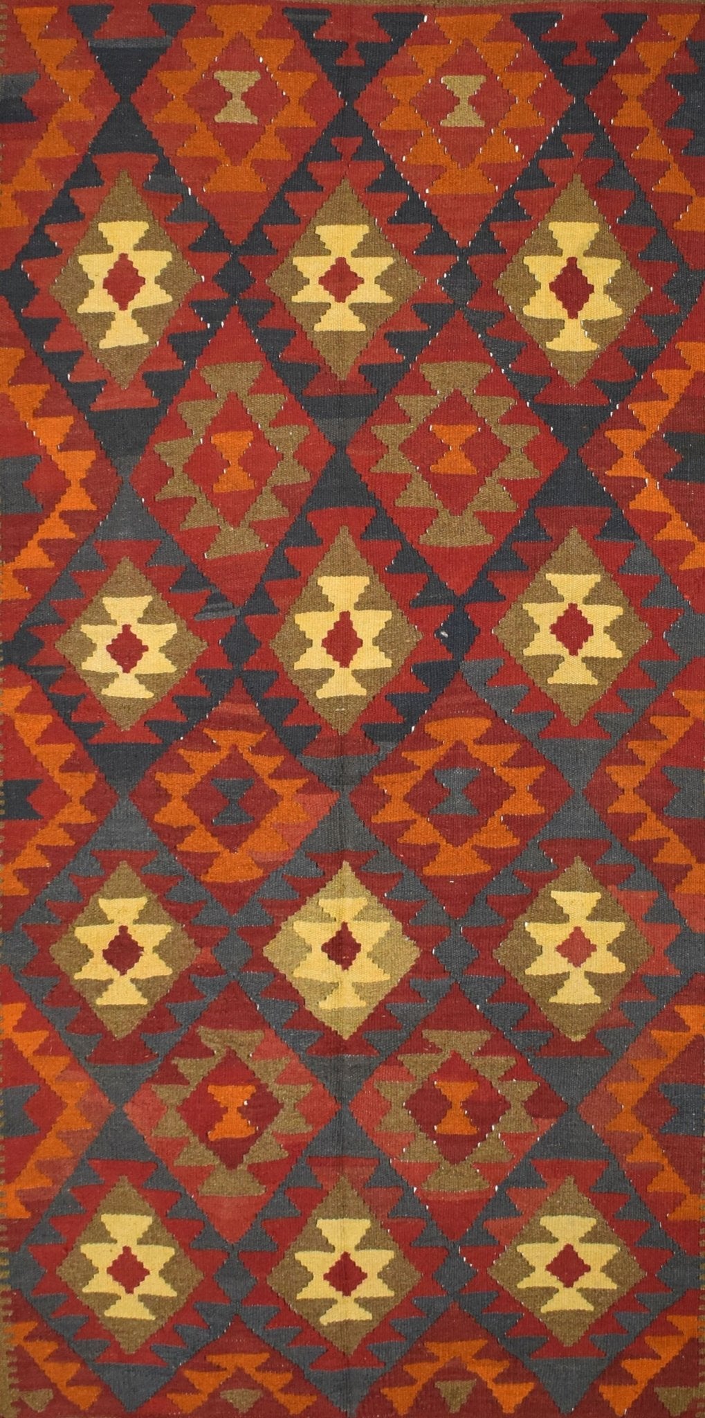 Handmade Afghan Maimana kilim rug featuring a repeating geometric diamond pattern in earthy tones.