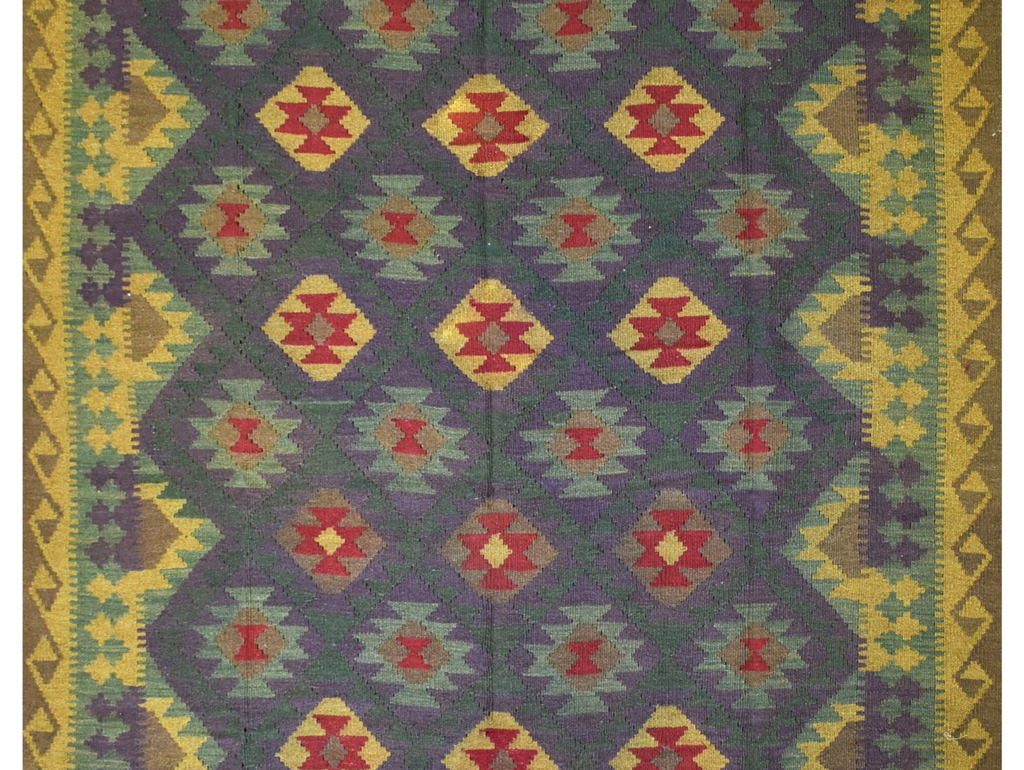 Handmade Afghan Maimana kilim rug featuring a repeating geometric diamond pattern in rich colors.