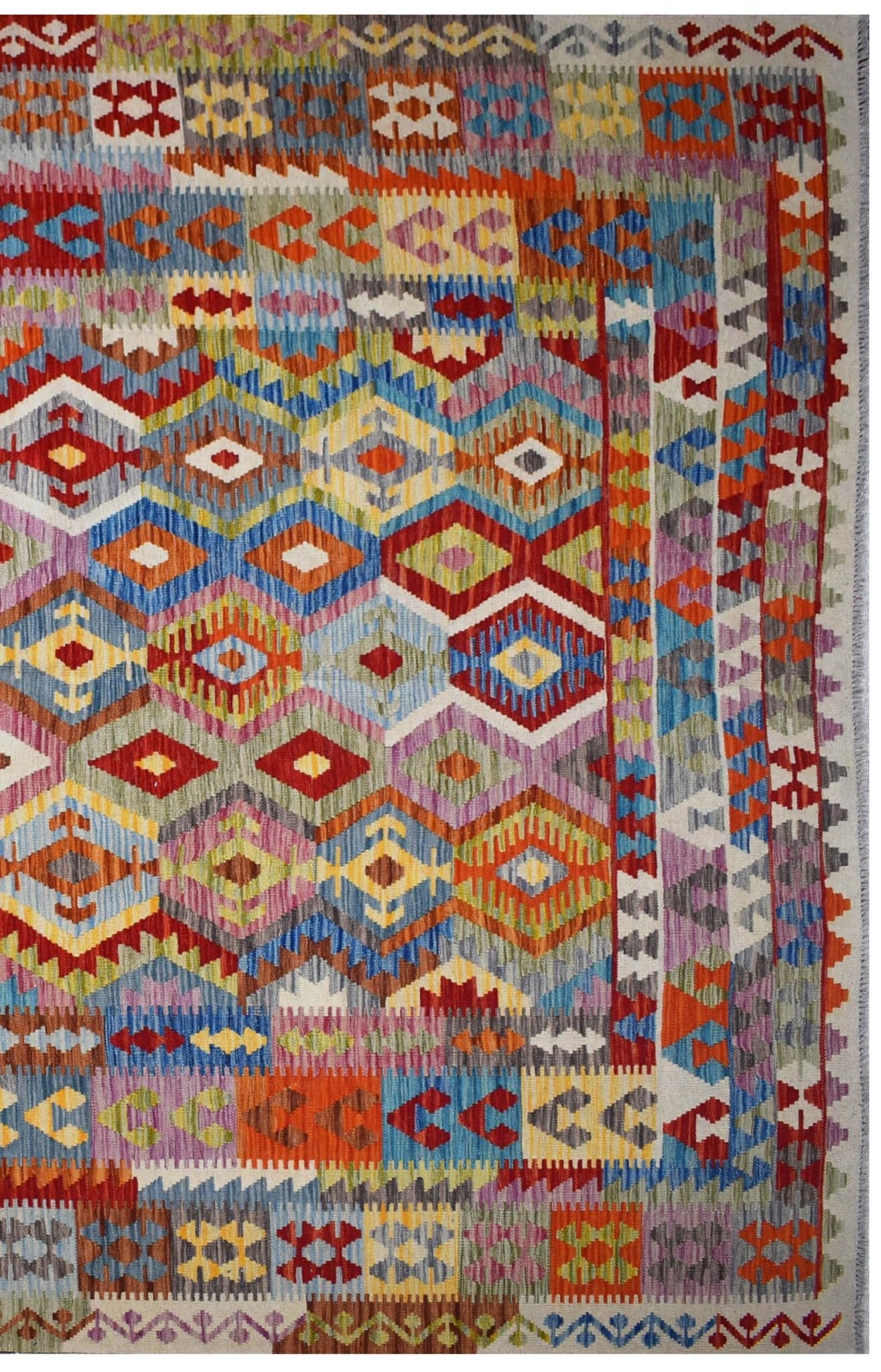 Handmade Afghan Maimana kilim rug featuring a vibrant geometric diamond pattern in wool.