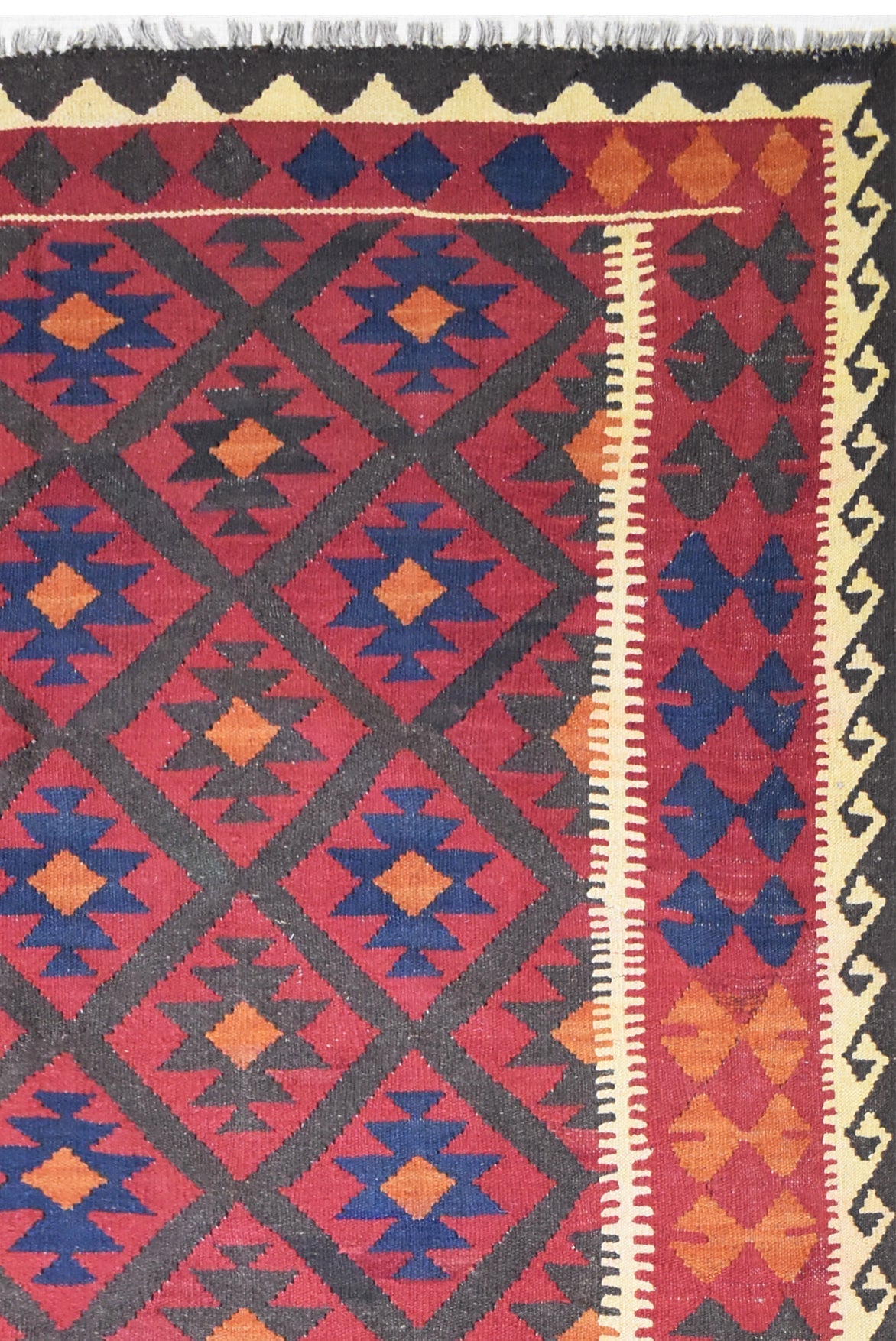 Handmade Afghan Maimana kilim rug featuring a geometric diamond pattern in red, blue, and orange.