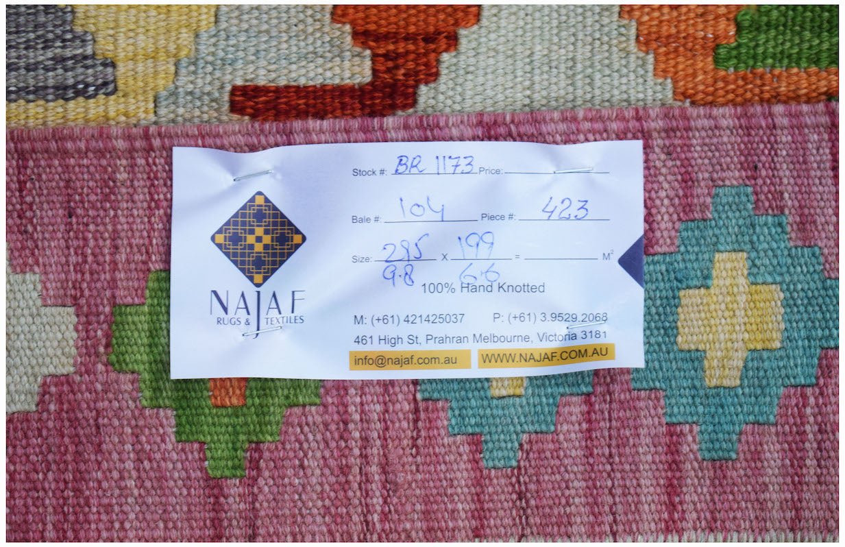 A handwoven Afghan Maimana kilim featuring a vibrant geometric pattern in wool.