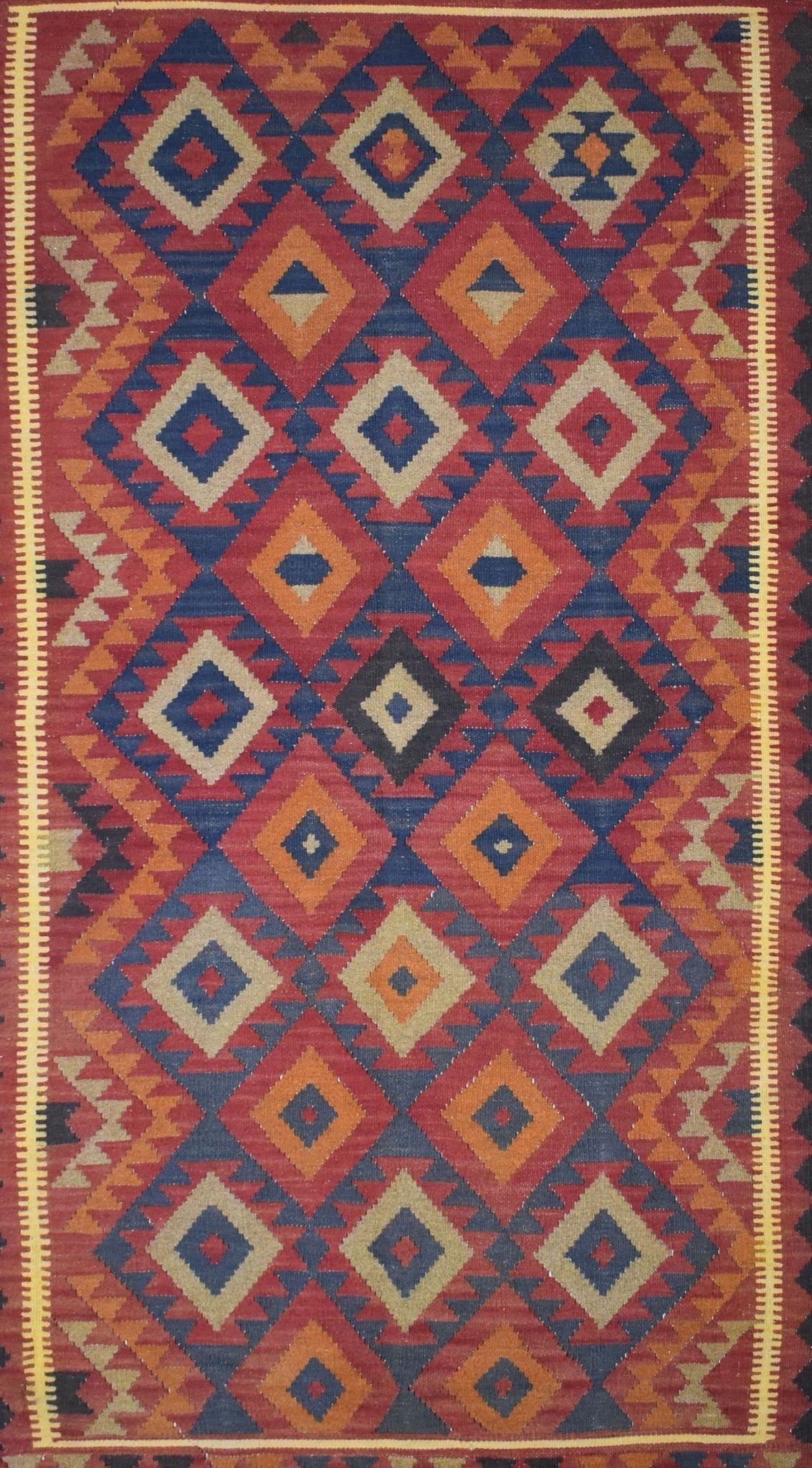 Handmade Afghan Maimana kilim rug featuring a vibrant geometric diamond pattern in wool.