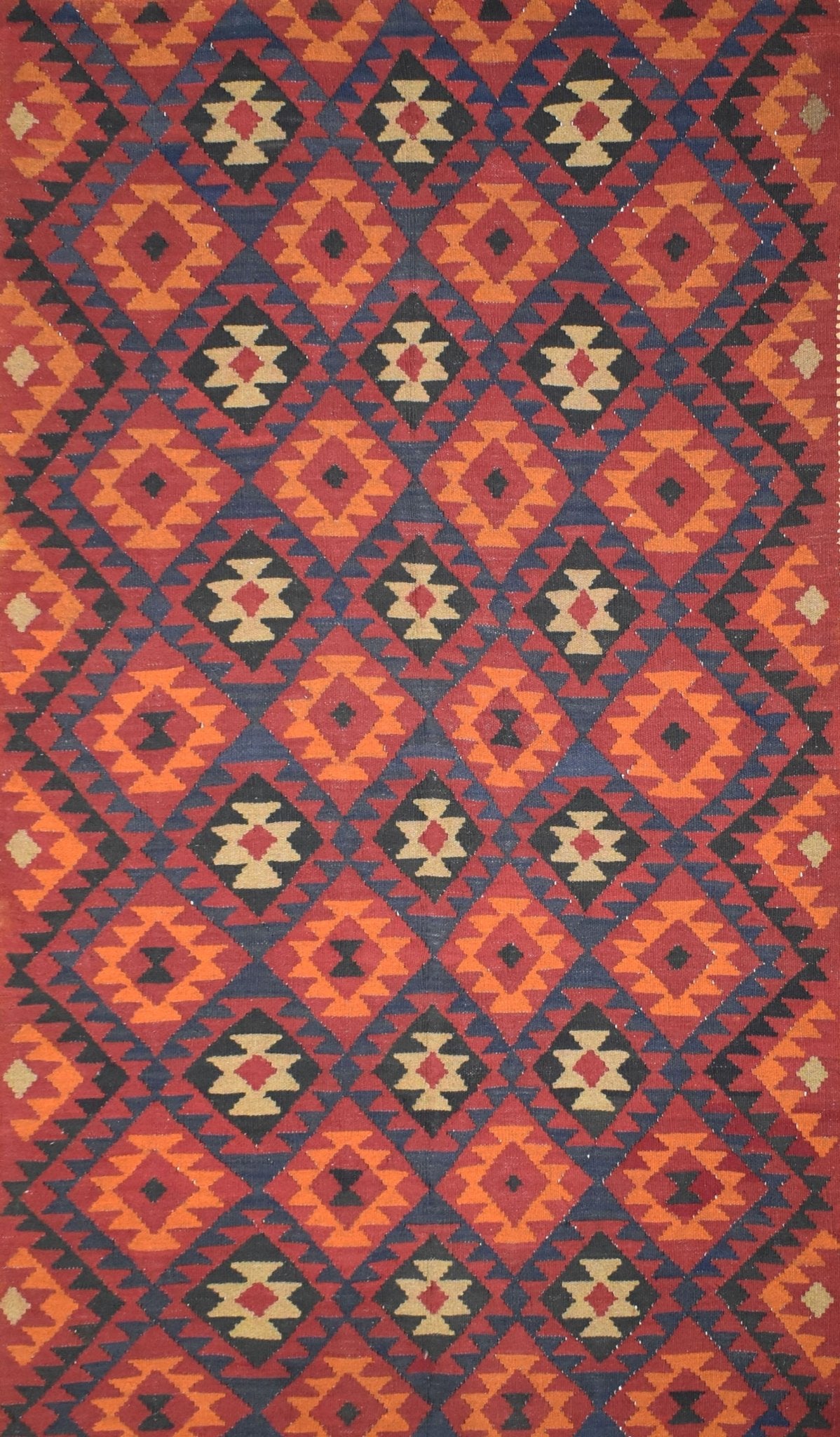 Handmade Afghan Maimana kilim rug featuring a repeating geometric diamond pattern in warm tones.