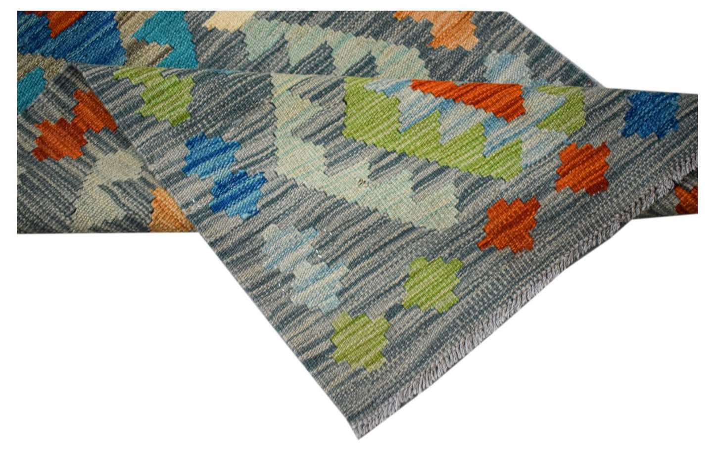 Handwoven Afghan Maimana wool runner featuring a geometric pattern in blue, orange, and green.