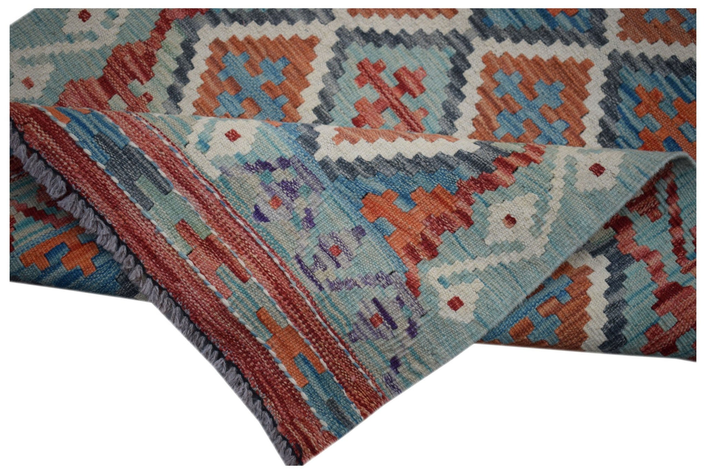 A handmade Afghan Maimana Kilim runner featuring a geometric pattern in blue, orange, and red.